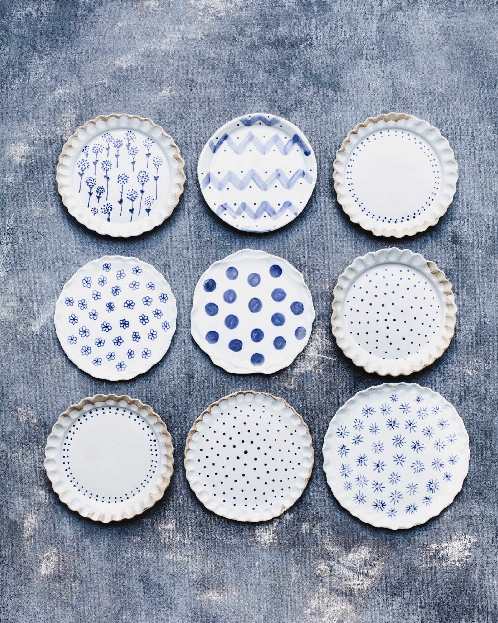 Handmade patterned ceramic plates by clay beehive