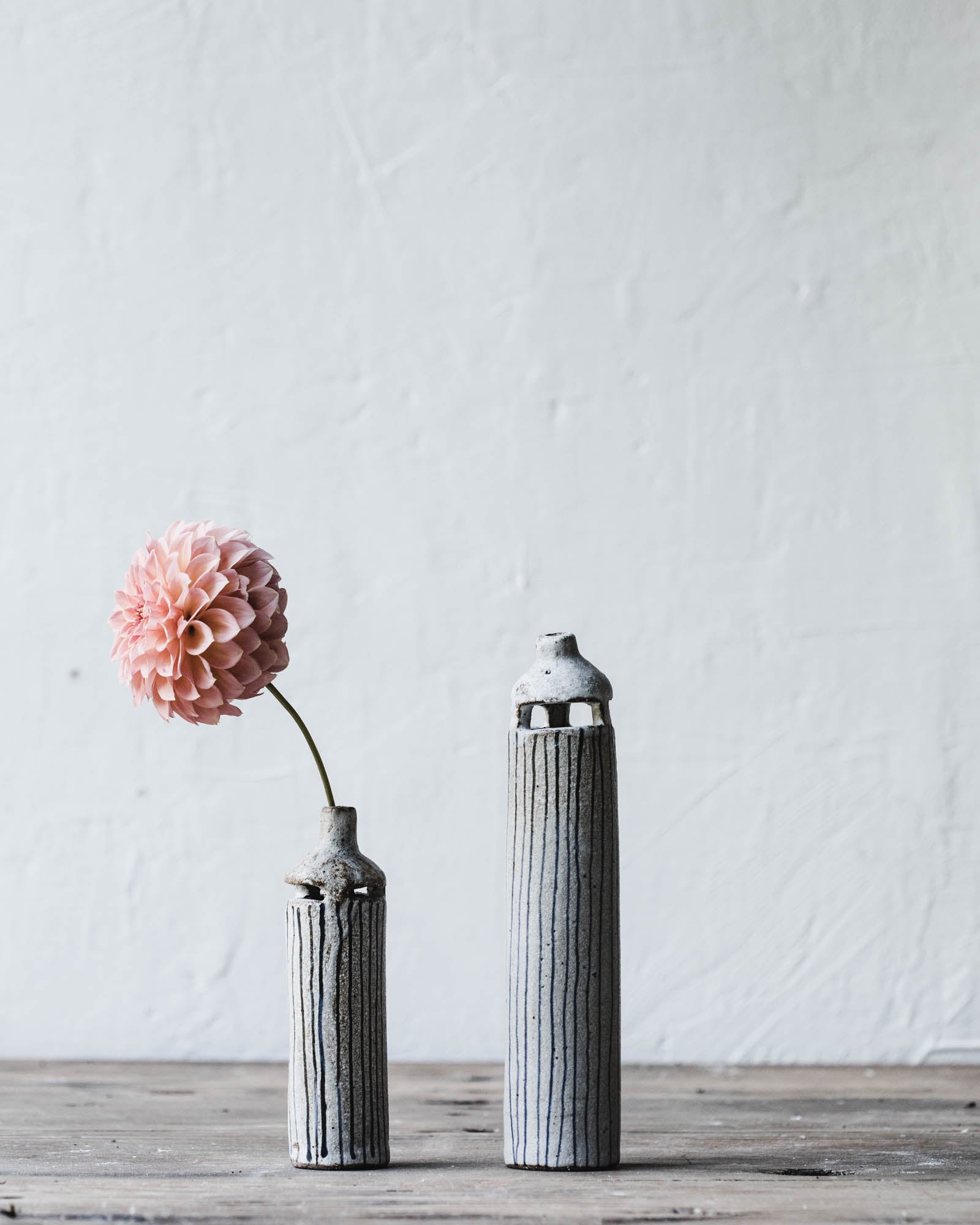 Slender bud vases with cutout details and lines by clay beehive ceramics