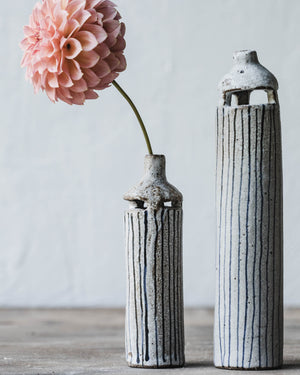 Slender bud vases with cutout details and lines by clay beehive ceramics