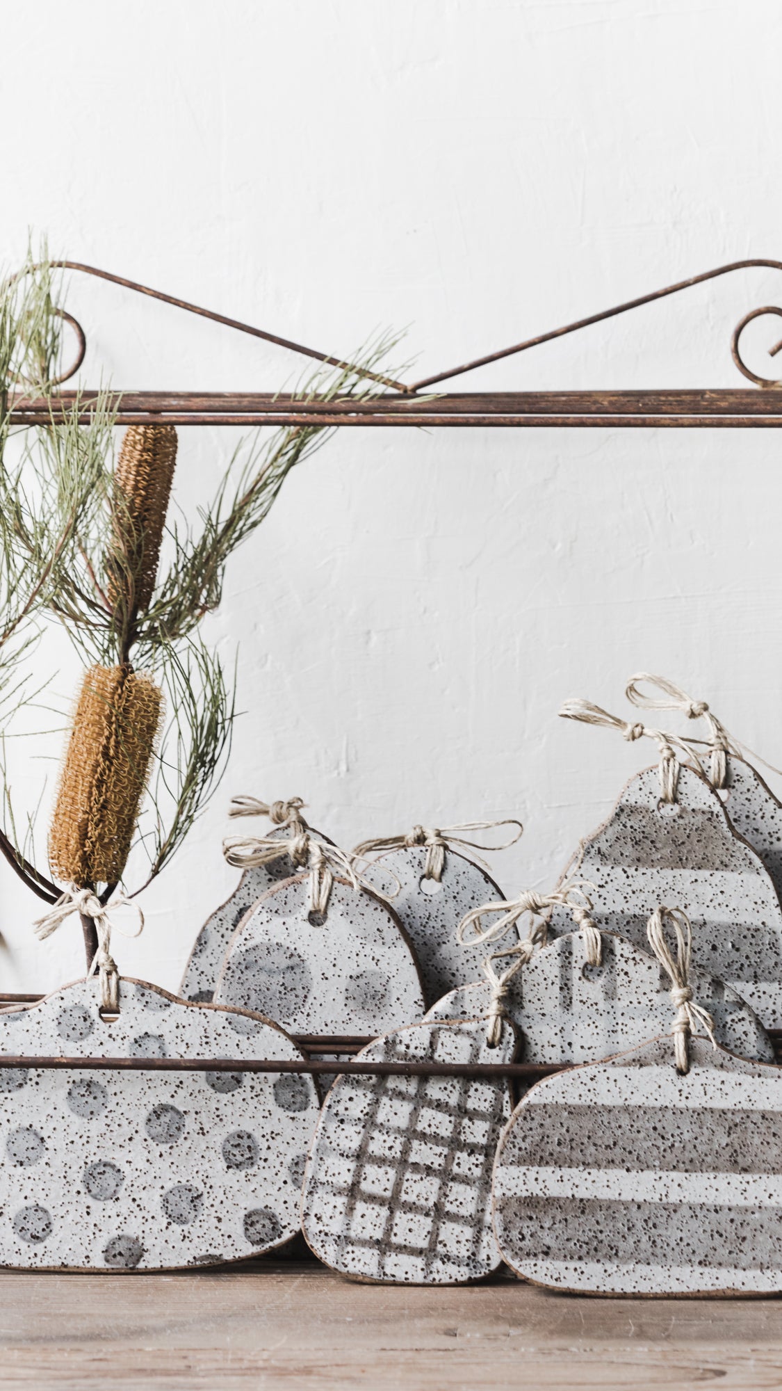 Handmade rustic speckled cheeseboards with hemp string crafted by clay beehive ceramics