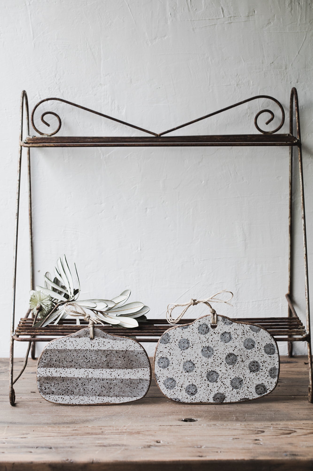 Handmade rustic speckled cheeseboards with hemp string crafted by clay beehive ceramics