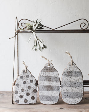 Handmade rustic speckled cheeseboards with hemp string crafted by clay beehive ceramics
