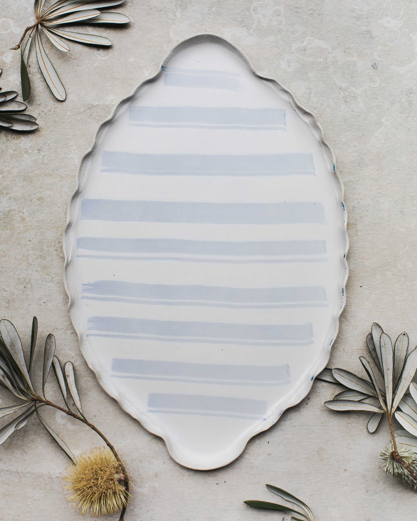 Handmade platter with easy grip handles in soft blue line pattern by clay beehive ceramics