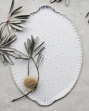 Handmade platter with easy grip handles decorated in blue and white spots and lines by clay beehive ceramics