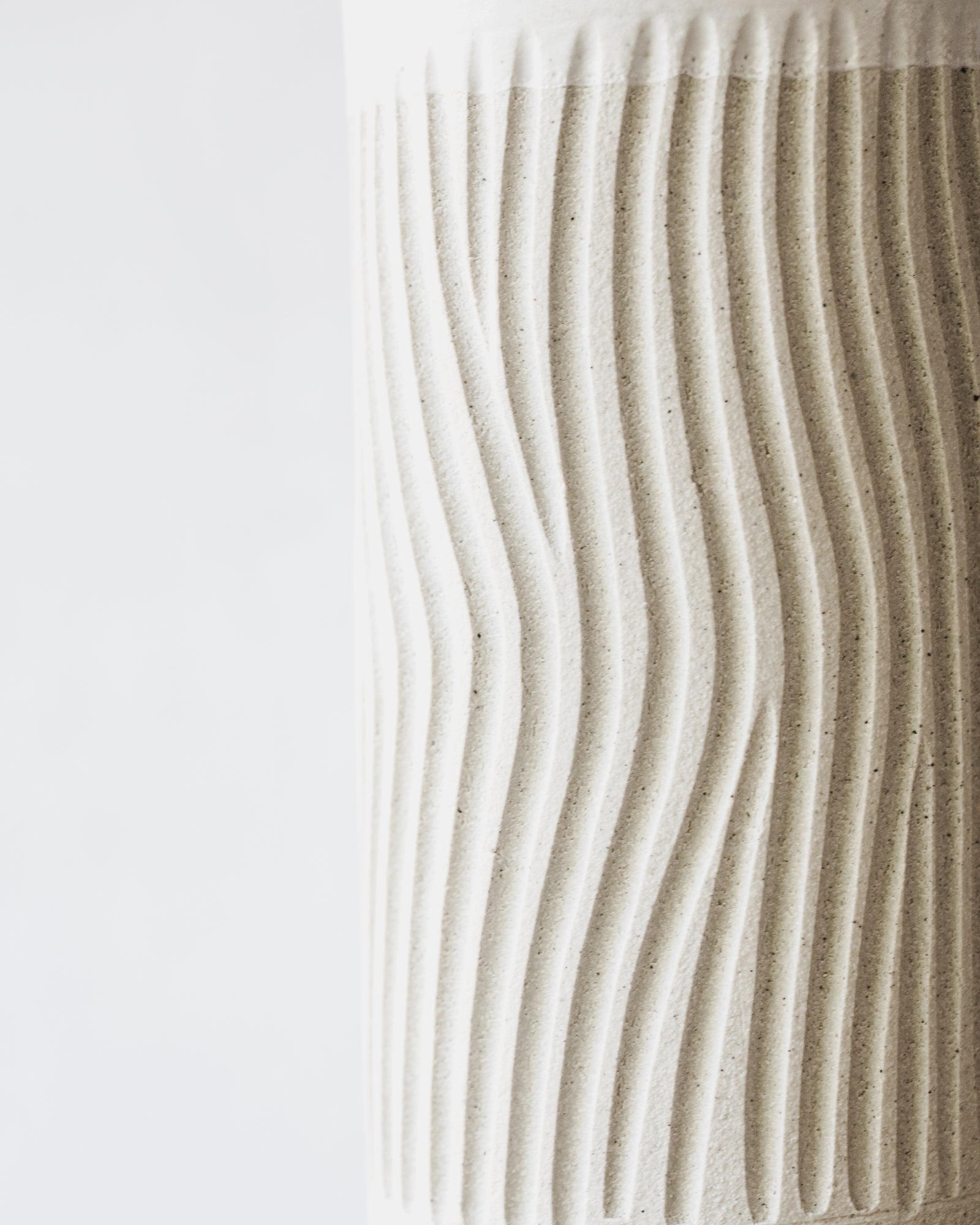 Hand-made tall cylindrical vase with carvings by clay beehive ceramics