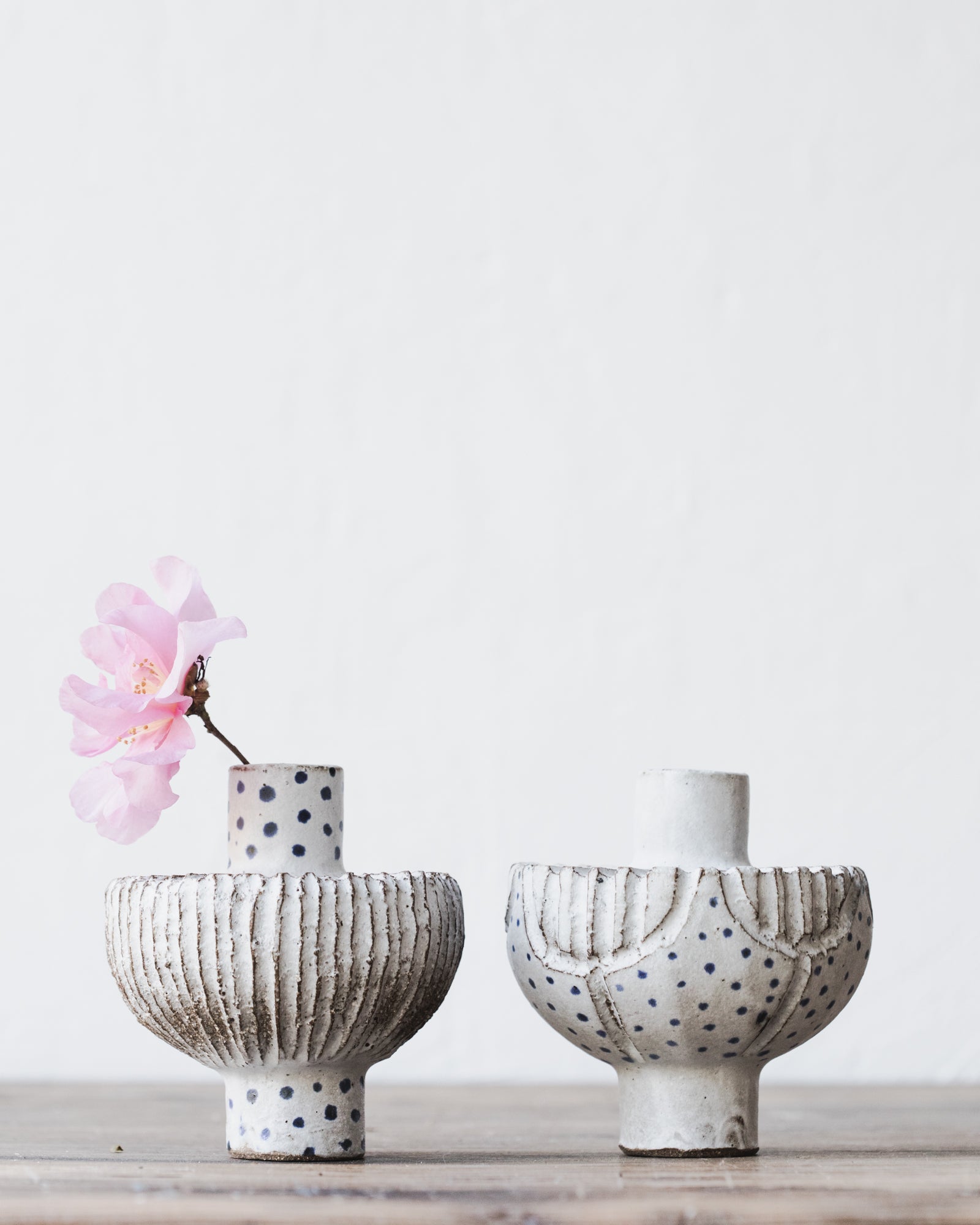 Handmade ceramic flat pod bud vases with carvings and blue freckles by clay beehive ceramics