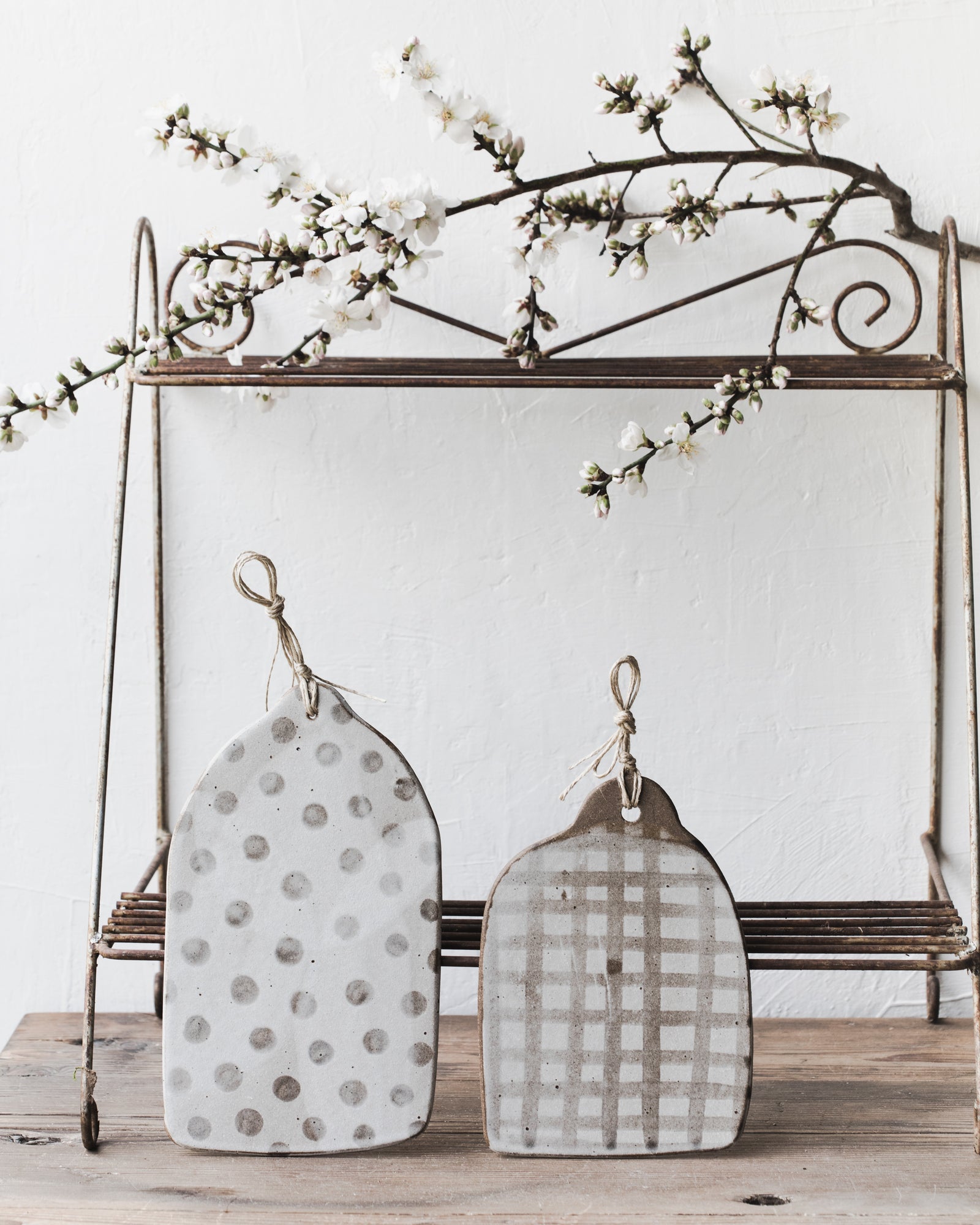 Handmade patterned ceramic cheese boards with hemp cord designed by clay beehive ceramics 