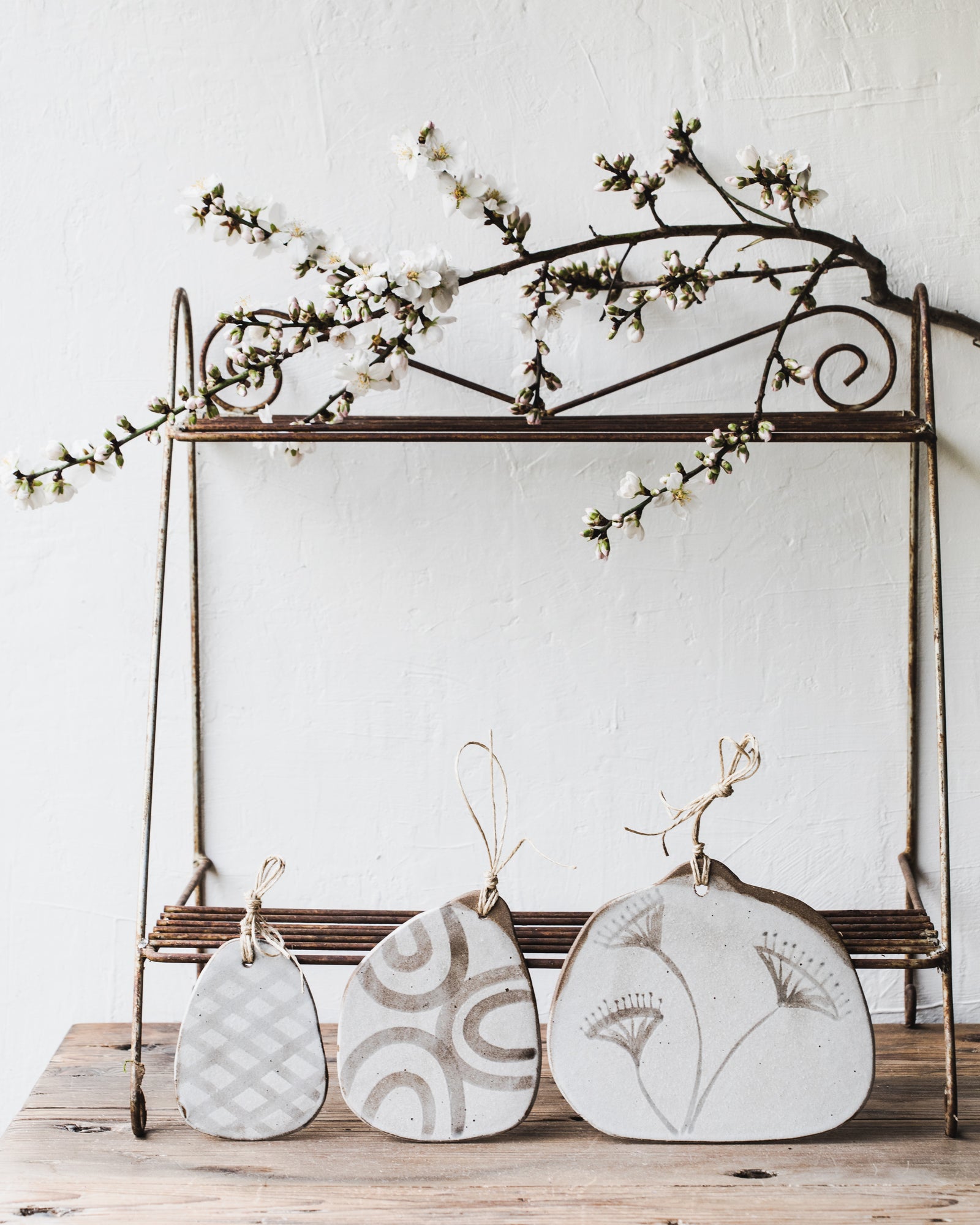 Handmade cheeseboards in dark stoneware with rustic brown/grey patterns and matte white finish by clay beehive ceramics