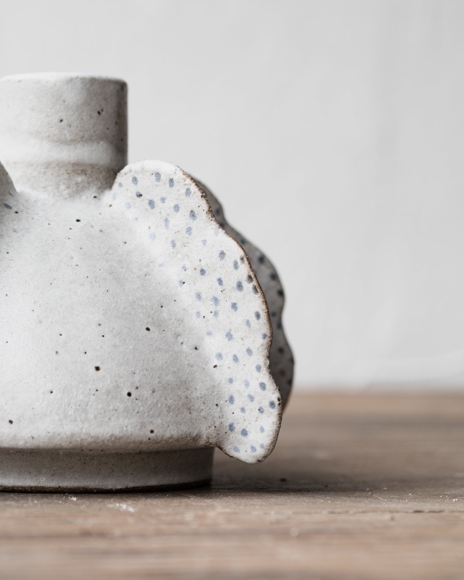 Handmade unique Anjali (angel wing) vases are sculptural and functional holding a single heavier branch stem by clay beehive ceramics