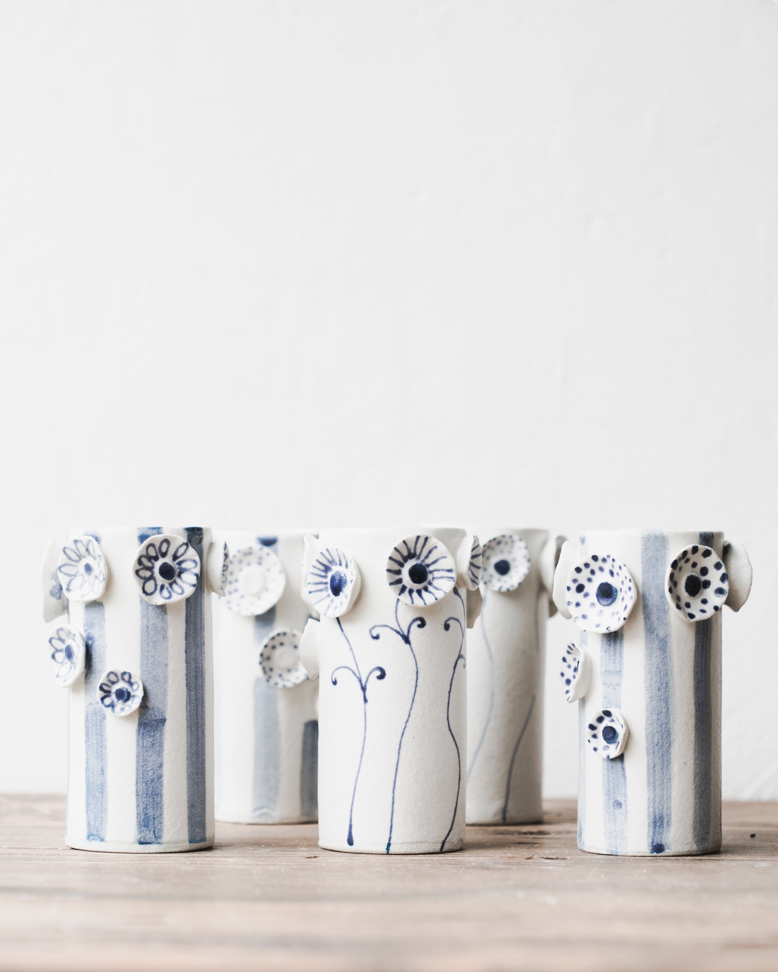 Flower and lines vase in blue and white designed by clay beehive ceramics