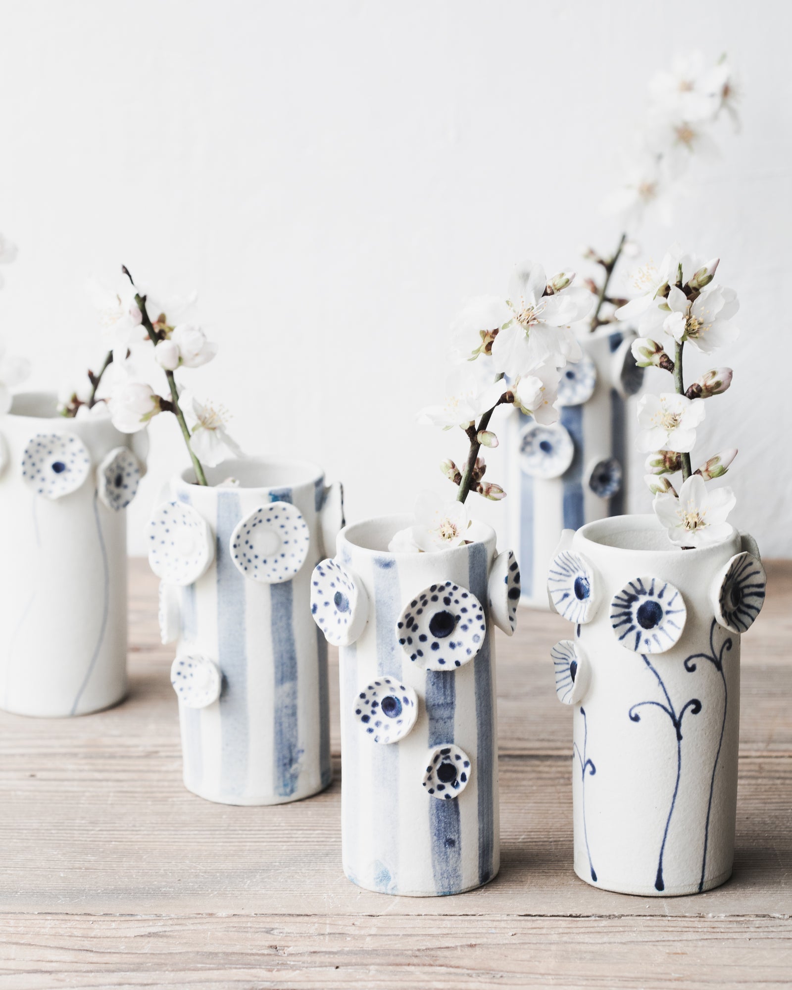 Flower and lines vase in blue and white designed by clay beehive ceramics