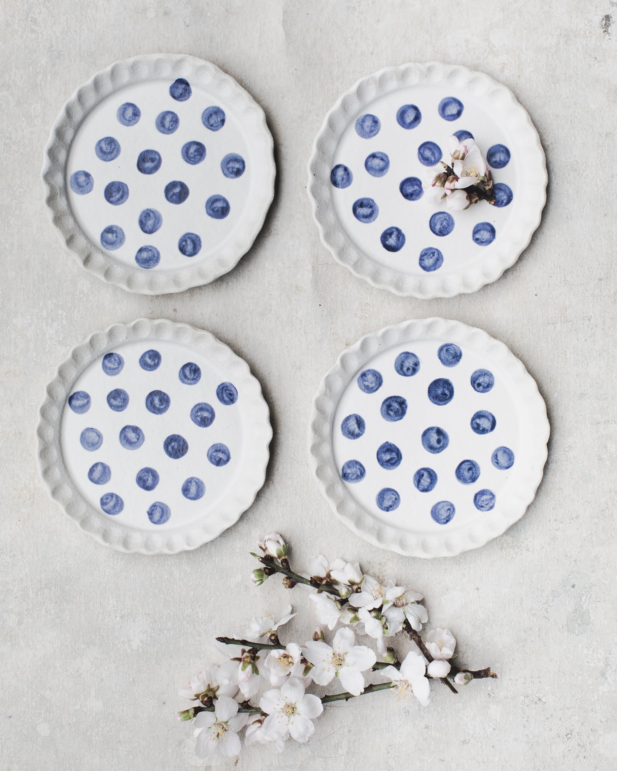 Handmade ceramic plates 14cm with scalloped rims and navy blue polka dots by Clay Beehive