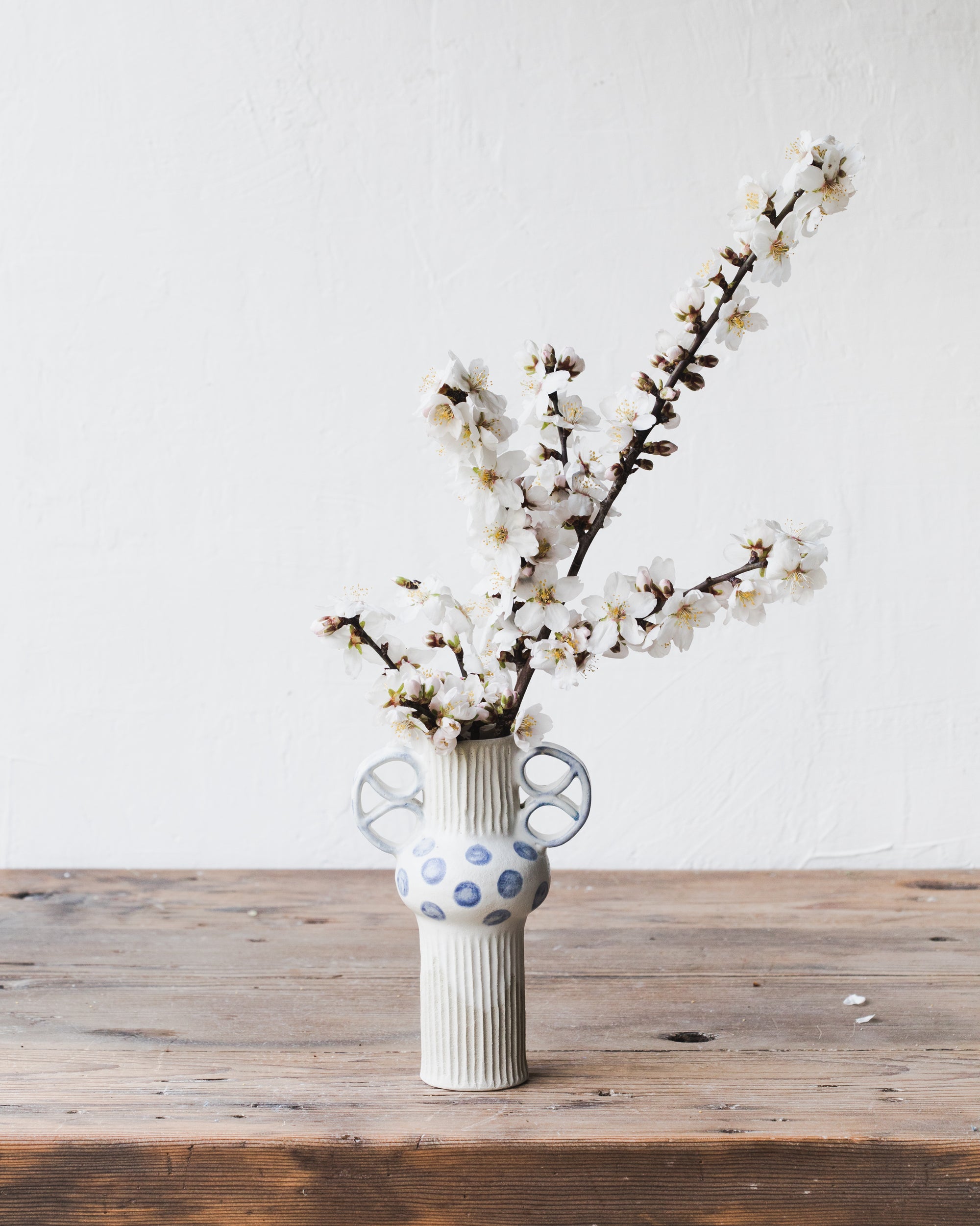 Blue polka dot pretzel handled vase by clay beehive ceramics