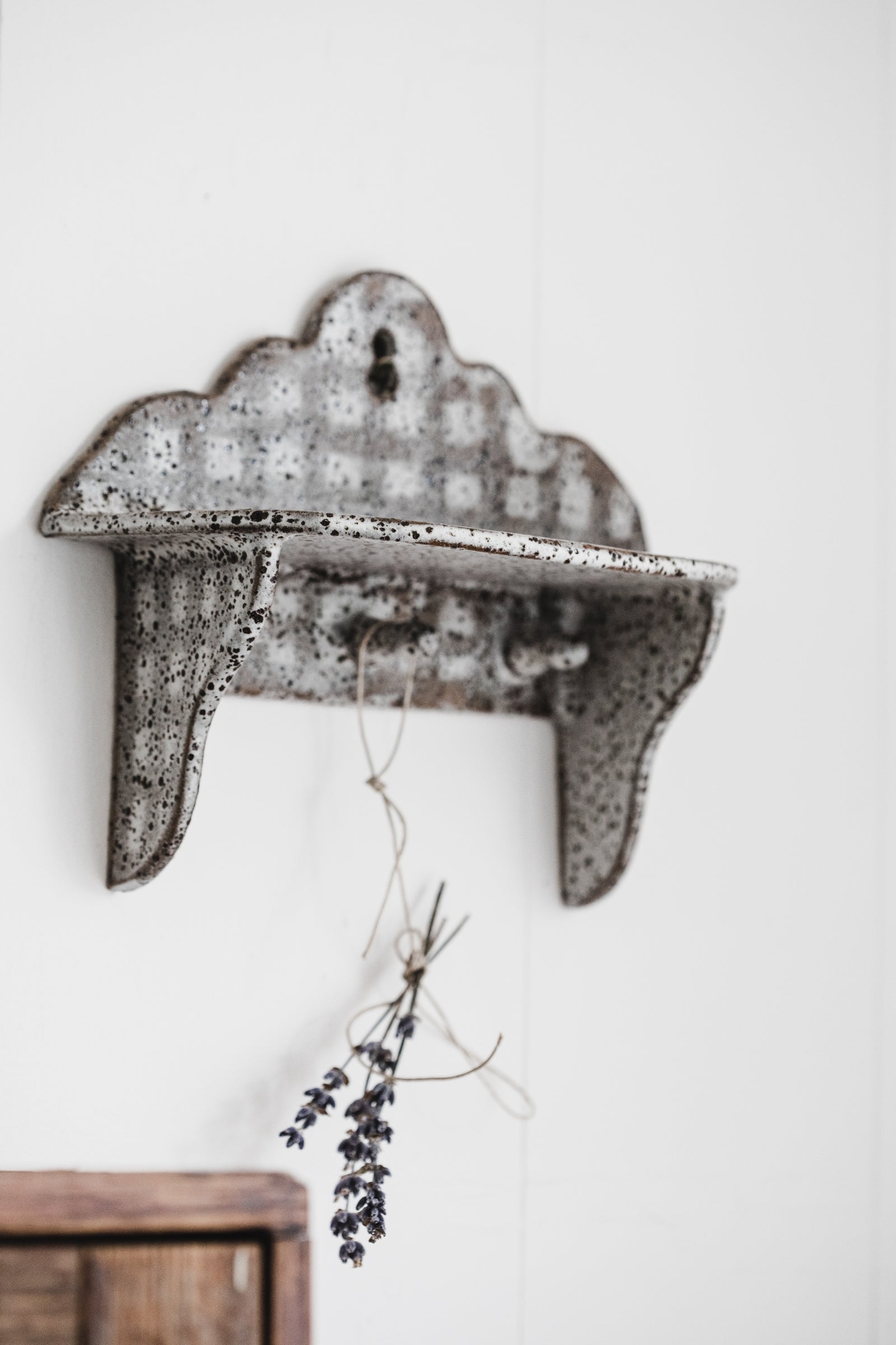 Rustic handmade wall shelf with scalloped rim details and little hangers by clay beehive ceramics