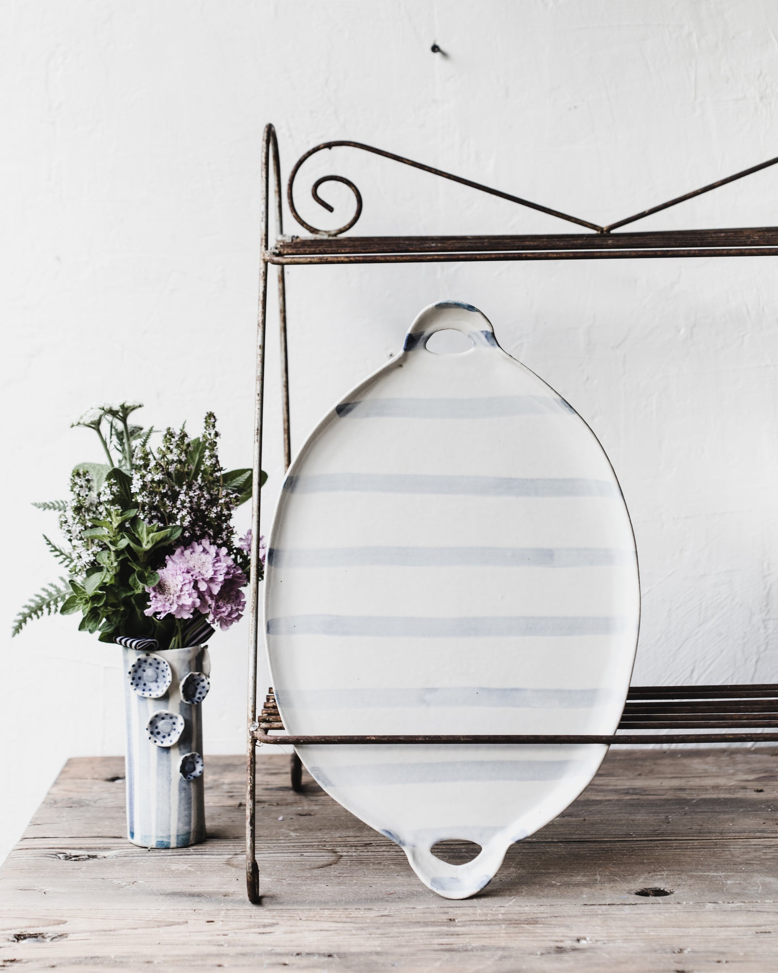 Blue and white patterned platters with cutout handles handcrafted by clay beehive ceramics