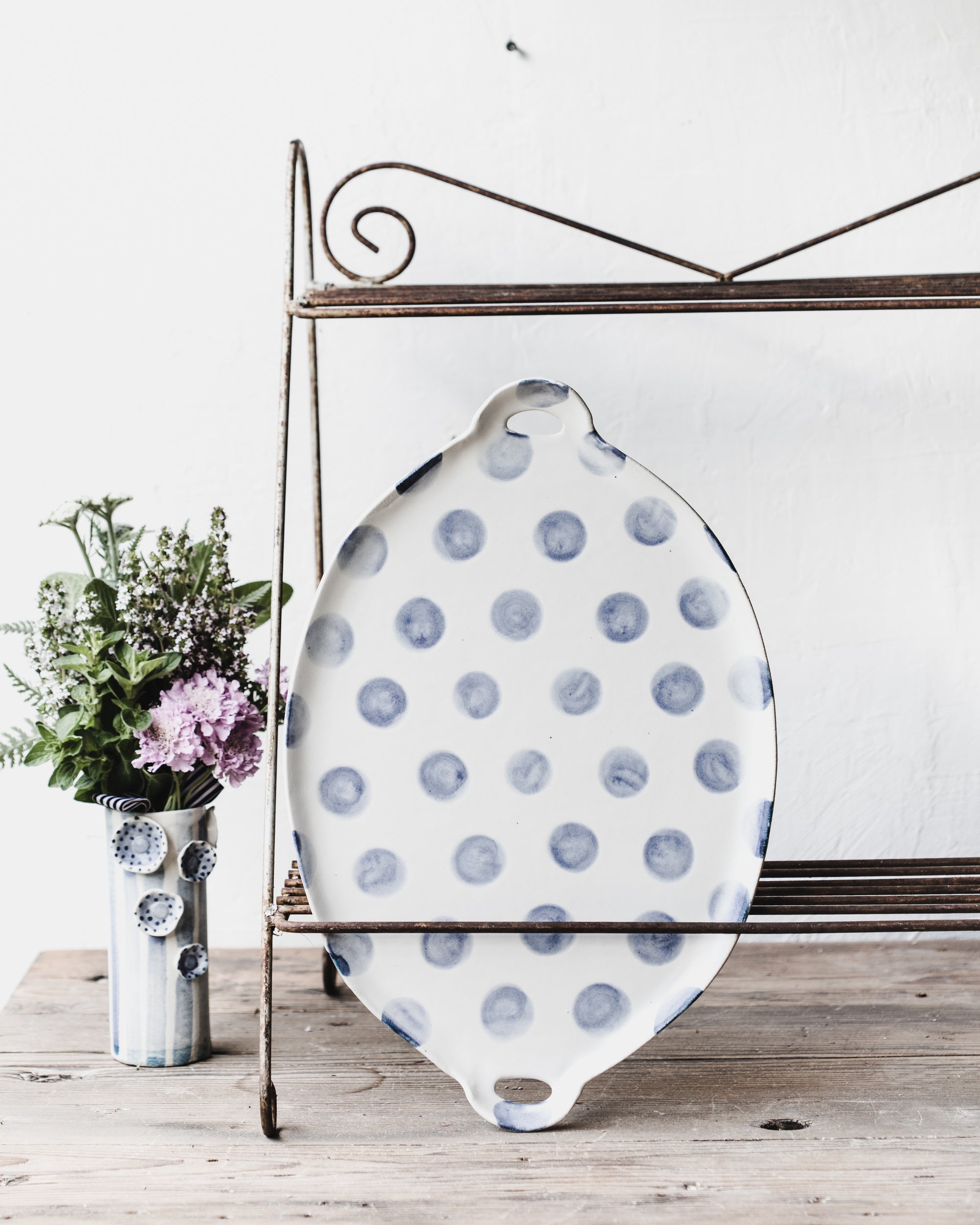 Blue and white patterned platters with cutout handles handcrafted by clay beehive ceramics