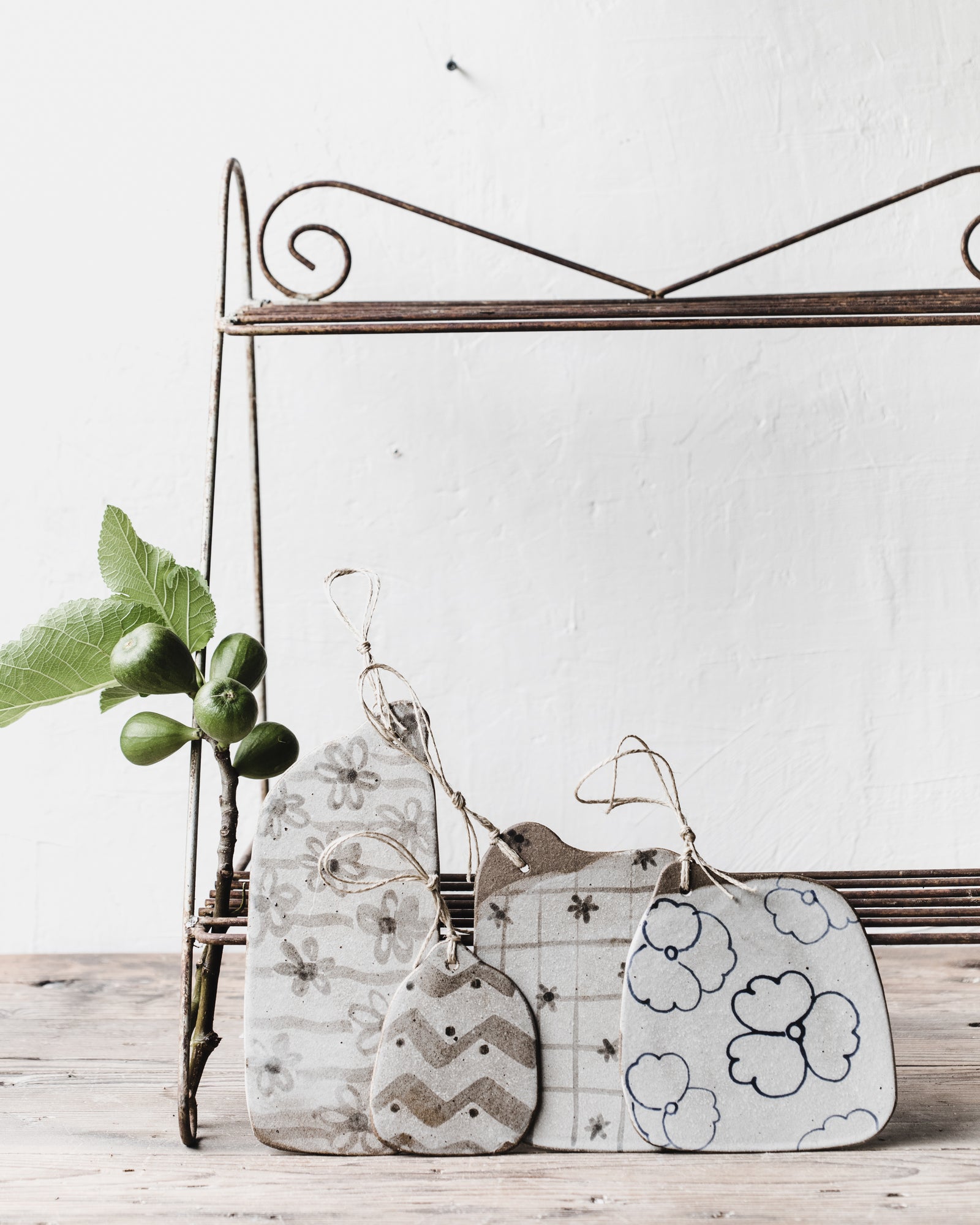 Dark Stoneware cheeseboards with patterns and illustrations in neutral earthy tones by clay beehive ceramics