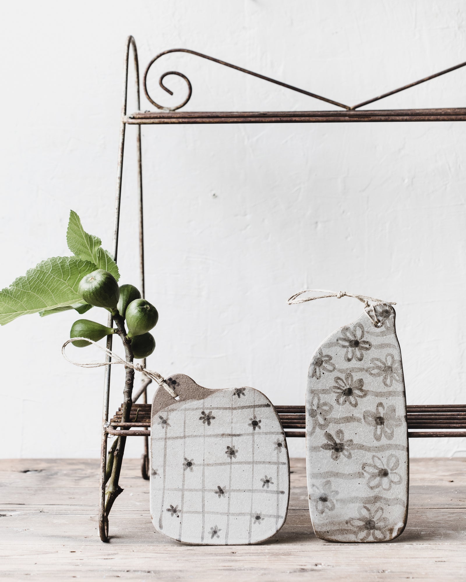 Dark Stoneware cheeseboards with patterns and illustrations in neutral earthy tones by clay beehive ceramics