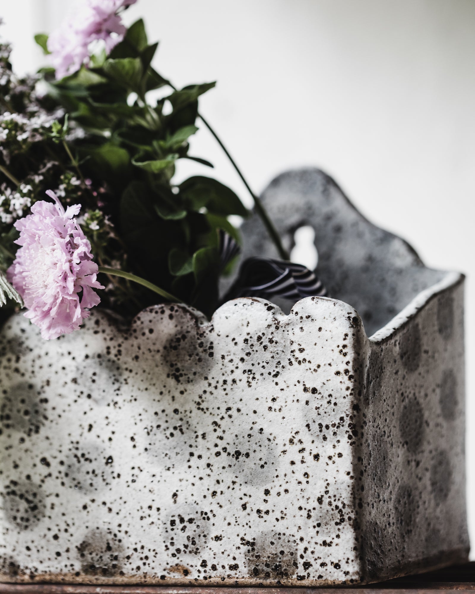 Hanging rustic speckled wall planter boxes with scalloped rim front and high back in grey/white speckled finish by Clay Beehive ceramics