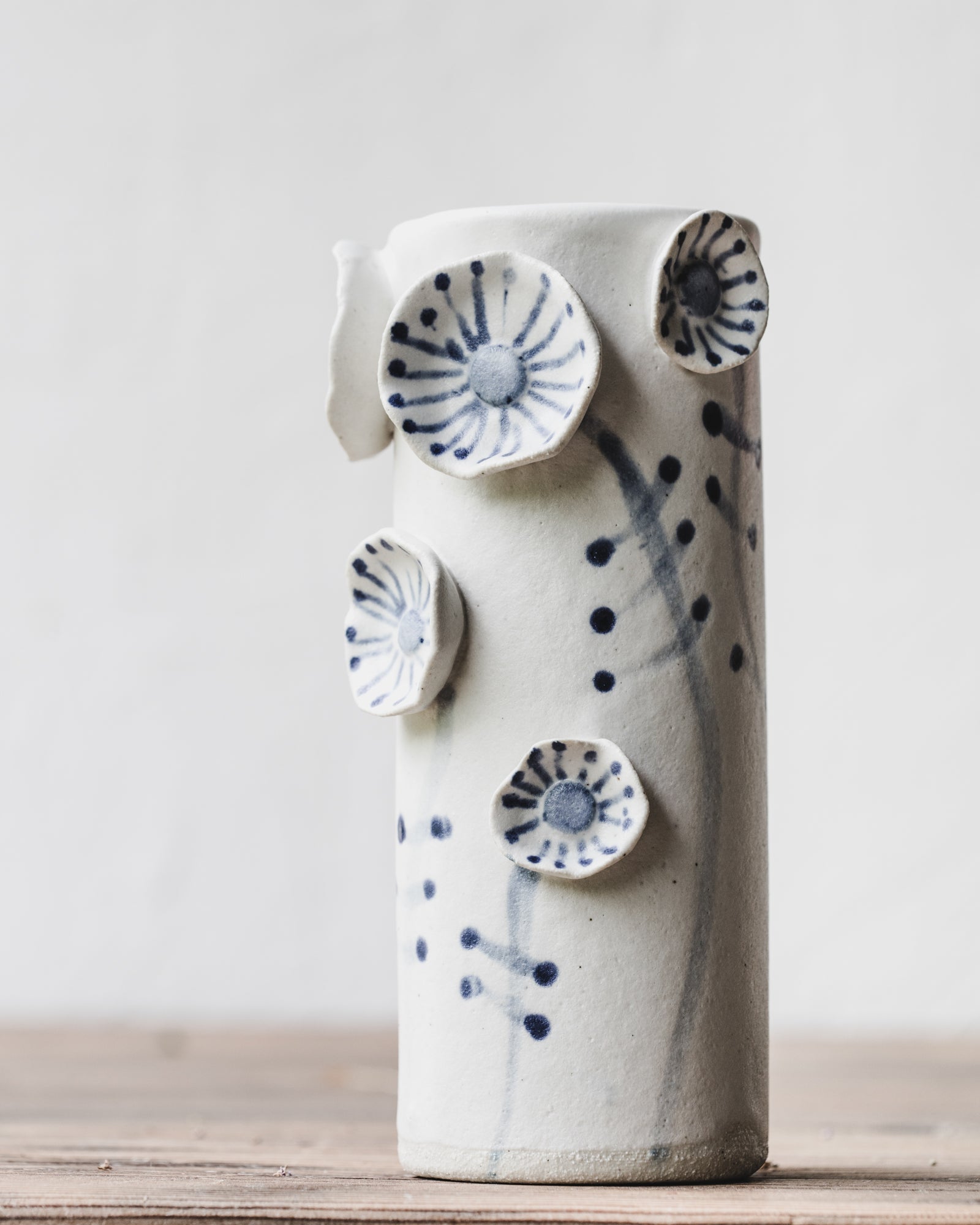 Flower vases with blue and white stem and line decorations by clay beehive ceramics