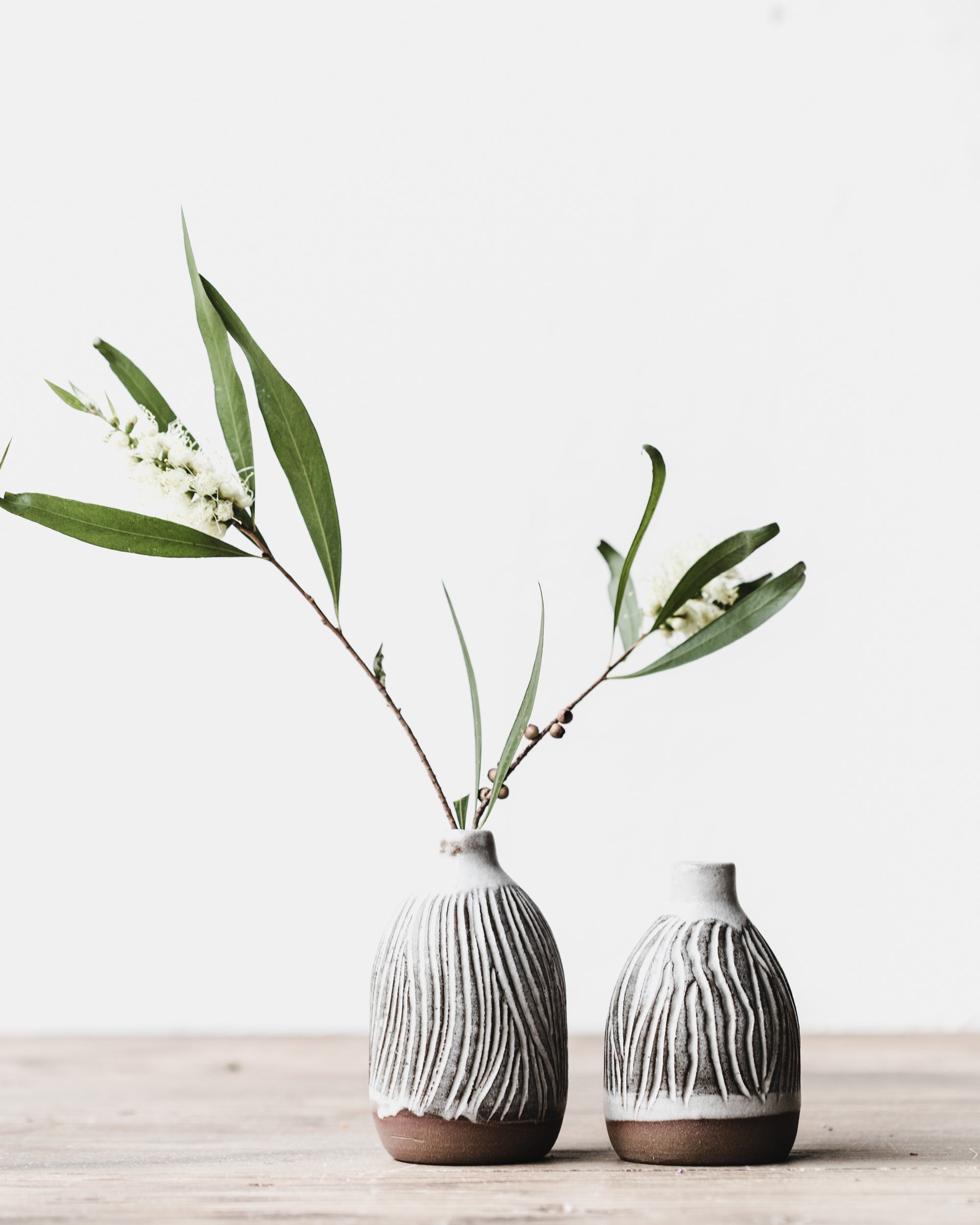 Red earth carved lines ceramic wheel thrown bud vases by clay beehive ceramics