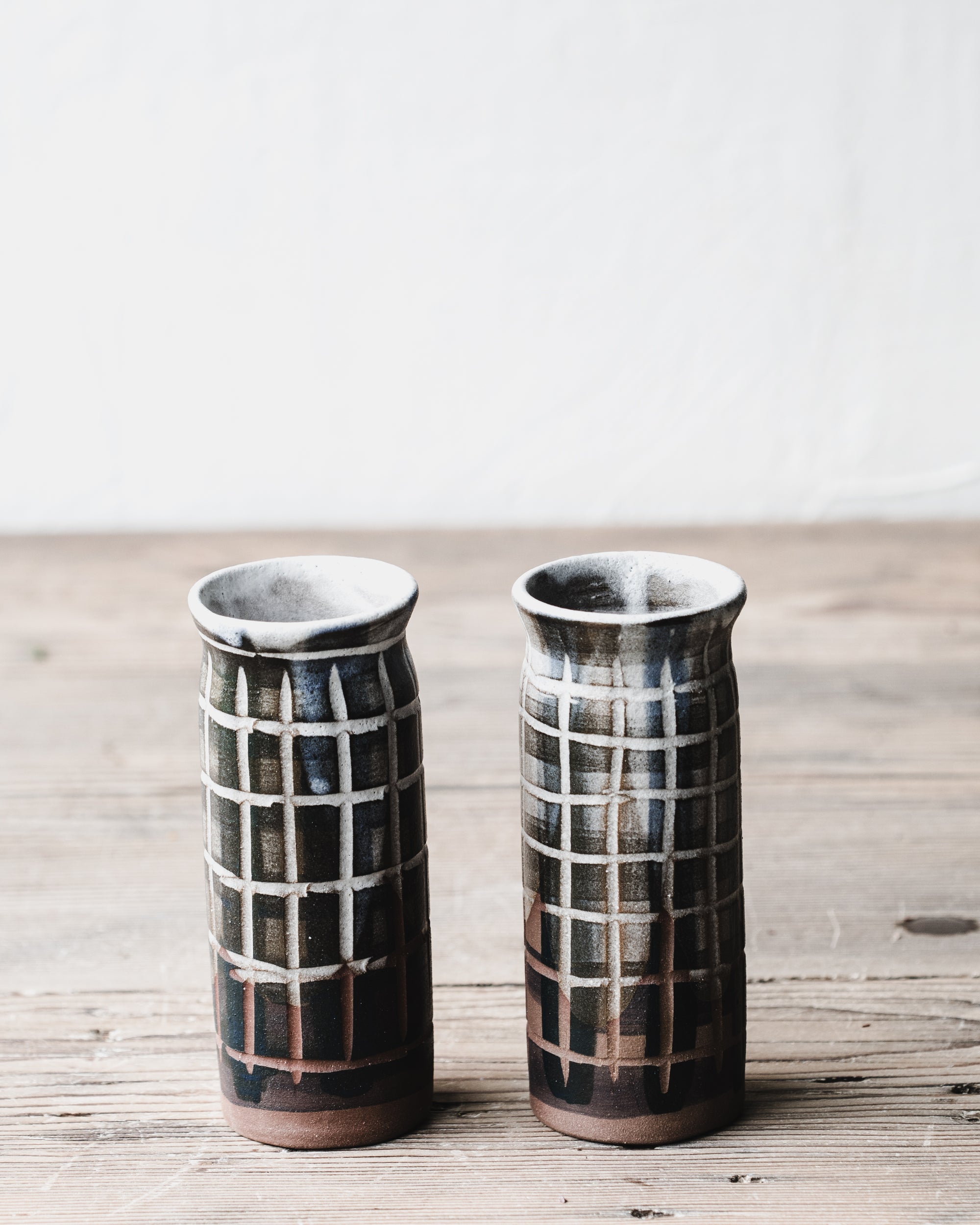 Carved tartan lined patterned slender tall vases handmade by clay beehive ceramics