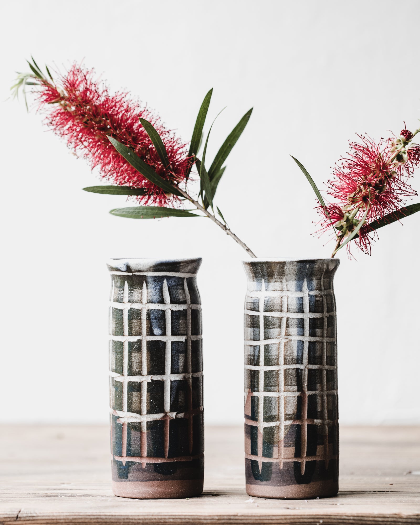 Carved tartan lined patterned slender tall vases handmade by clay beehive ceramics