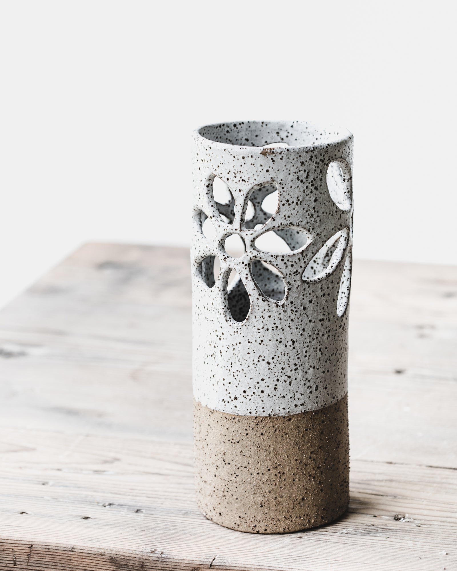 Large 25cm tall rustic speckled flower cutout vase handmade by clay beehive ceramics