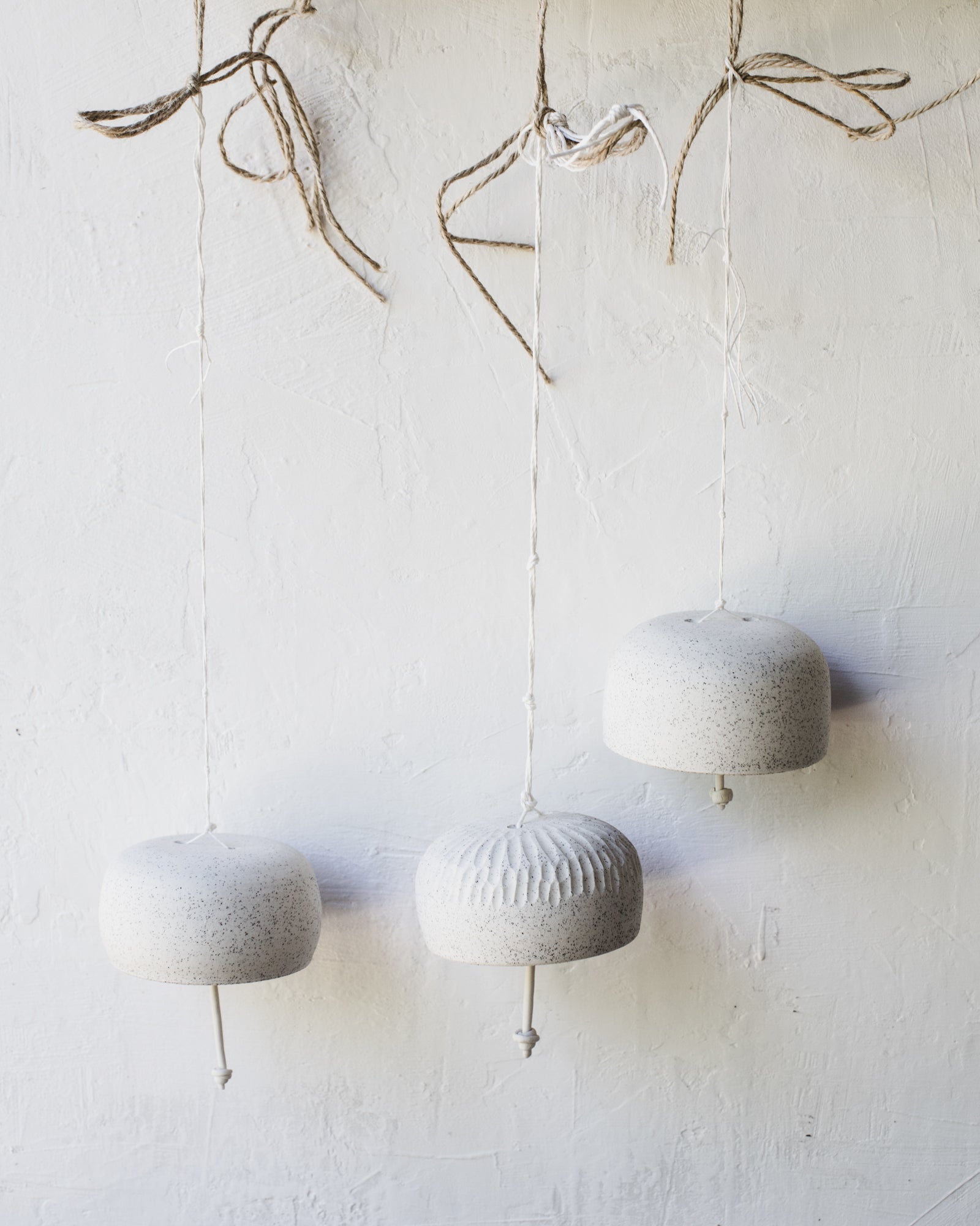 Speckled white decorative bells with a gorgeous ringing sound (Group Four)
