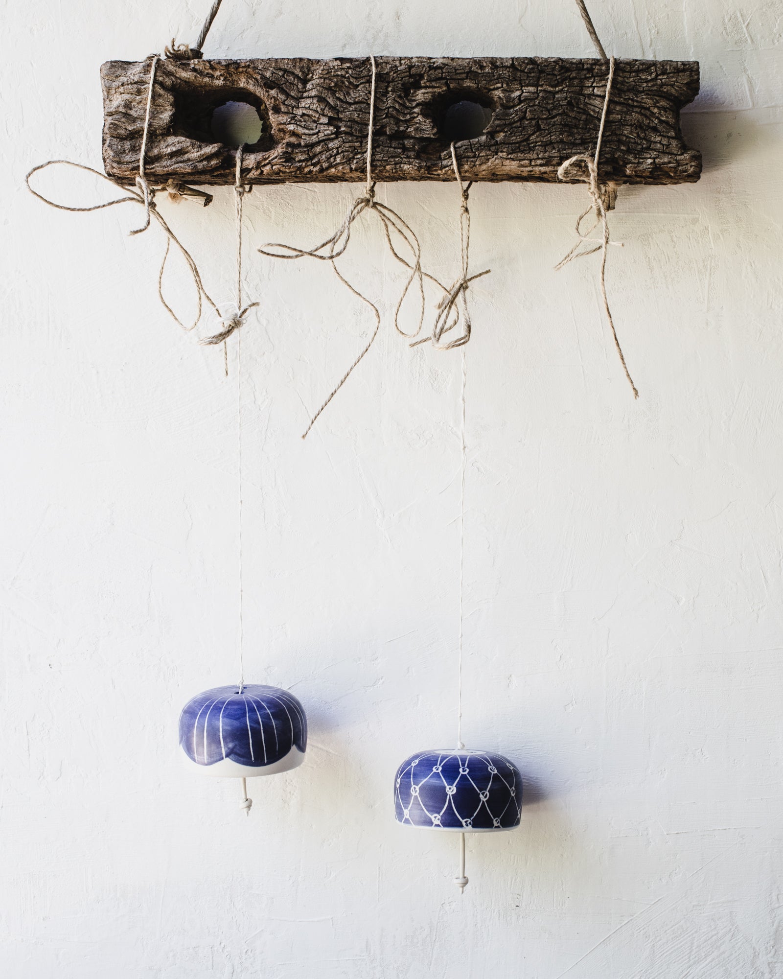 Beautiful ringing blue and white handmade ceramic bells by clay beehive