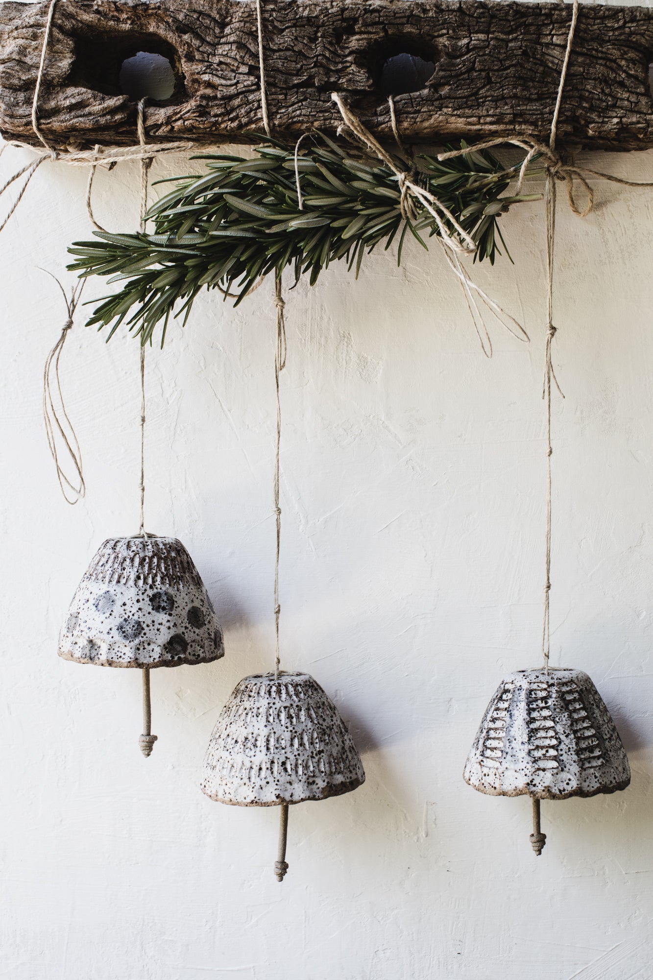 Rustic carved patterned bells handmade by clay beehive ceramics