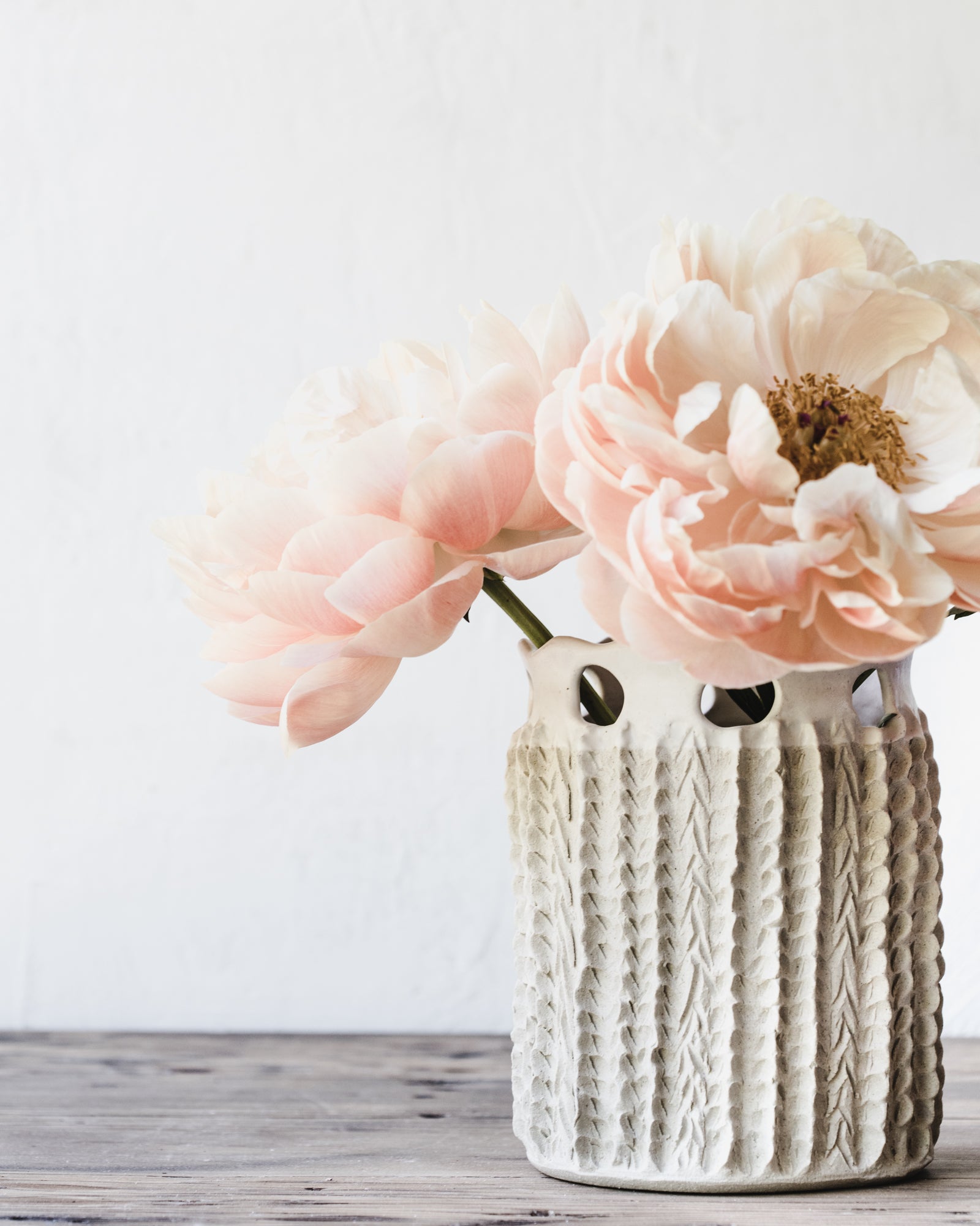 Large handmade vase with textures and cutout design in satin white by clay beehive