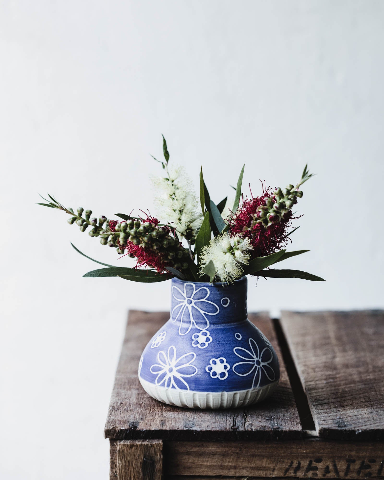 Blue and white vase with carved flowers handmade by clay beehive ceramics