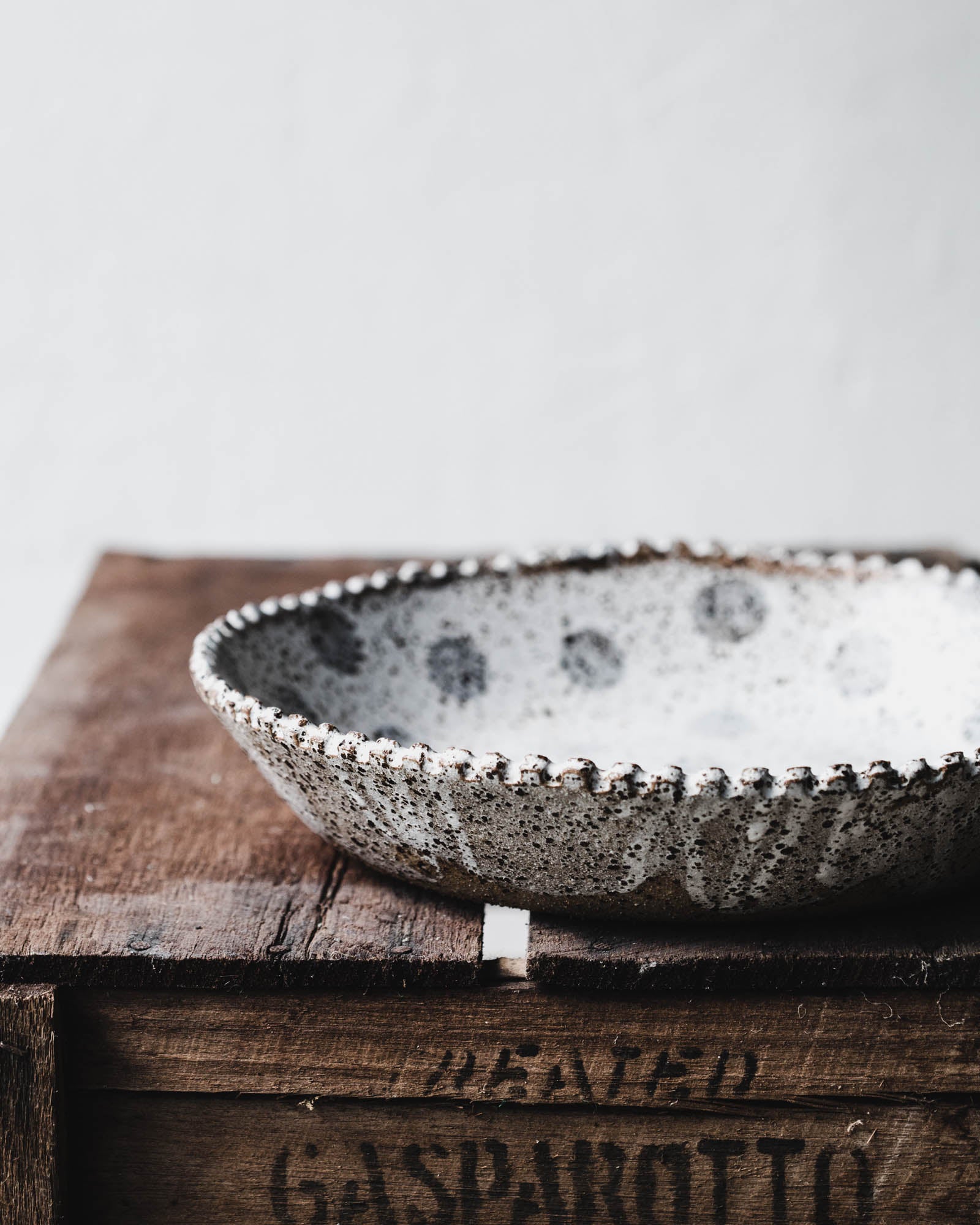Rustic scallop rim bowl with grey polka dot handmade by clay beehive ceramics