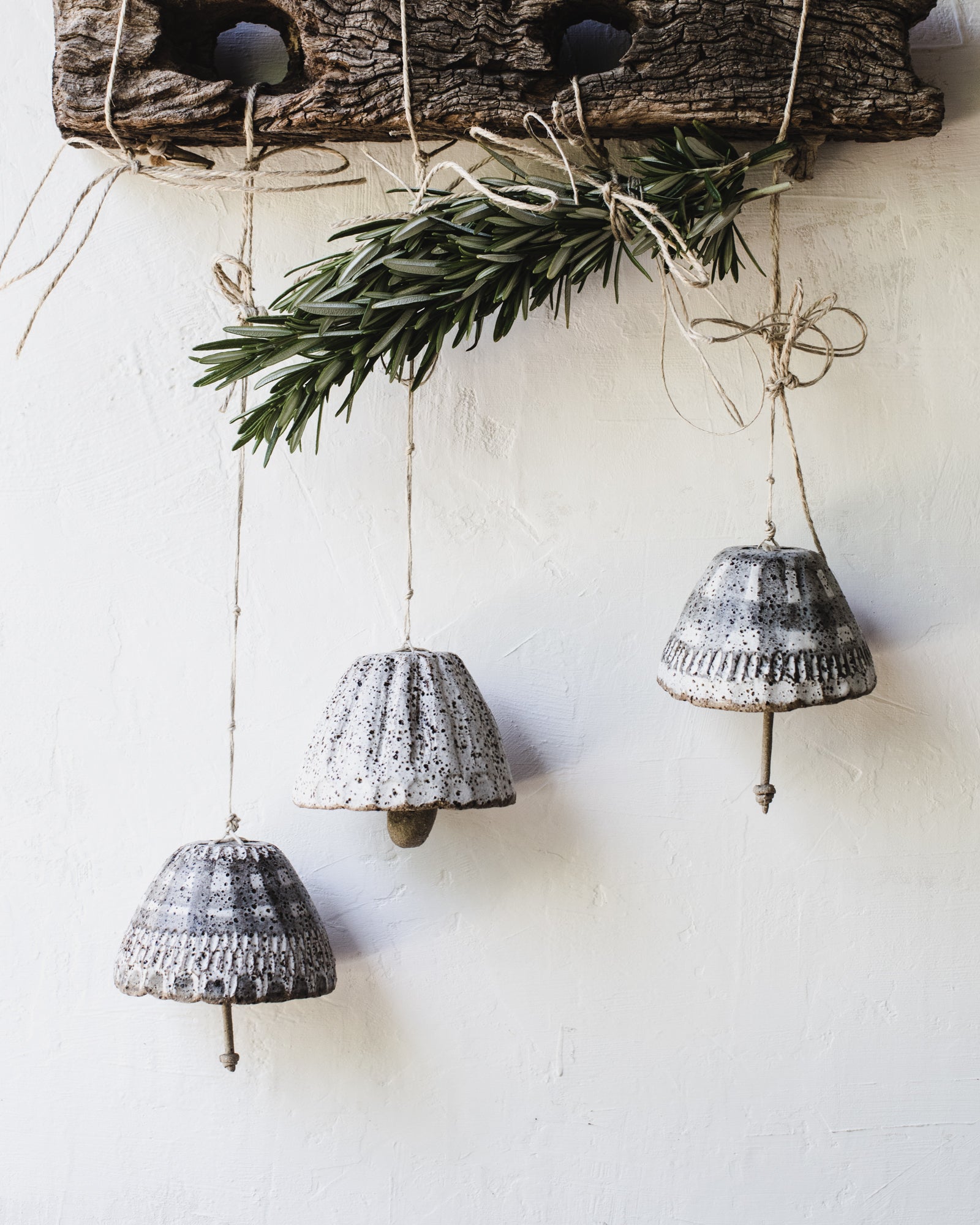 Rustic carved patterned bells handmade by clay beehive ceramics