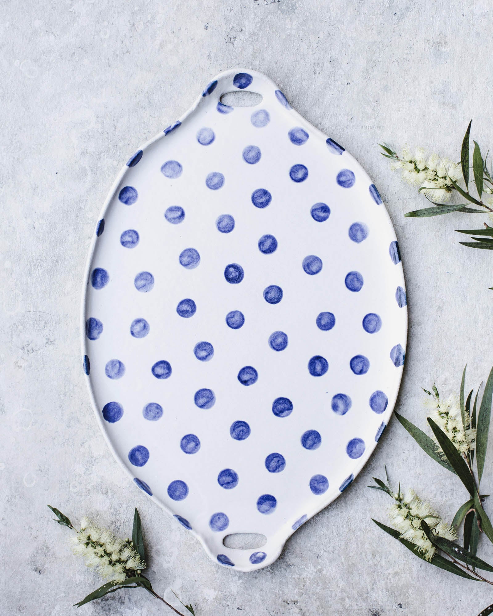 Larger handled navy blue polka dot platter by clay beehive ceramics