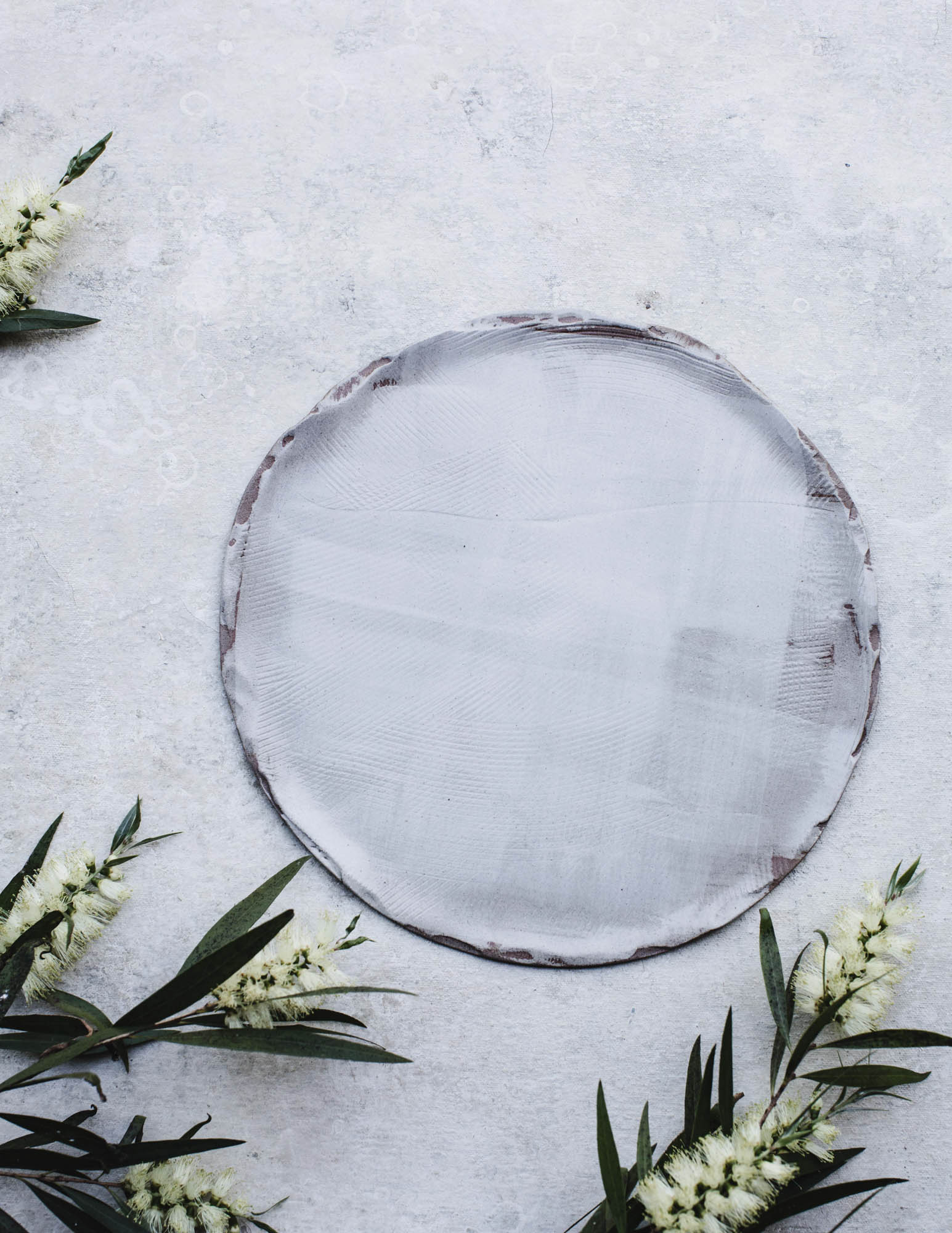 Satin white textured plate and bowl set by clay beehive