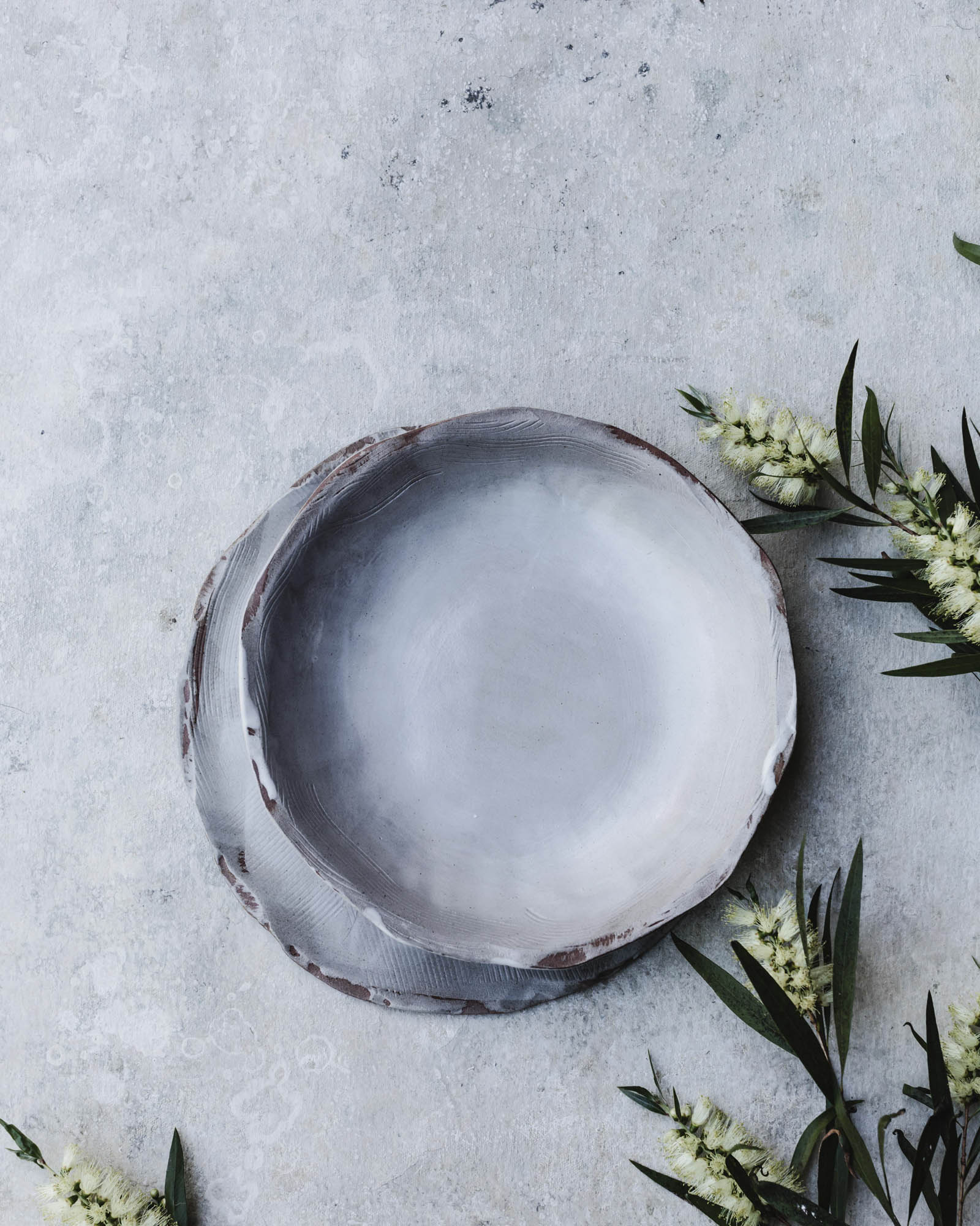 Satin white textured plate and bowl set by clay beehive