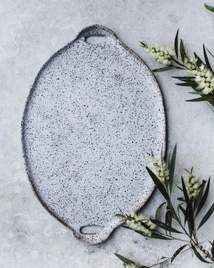 Patterned textured speckled satin white platter with cutout handles by clay beehive ceramics