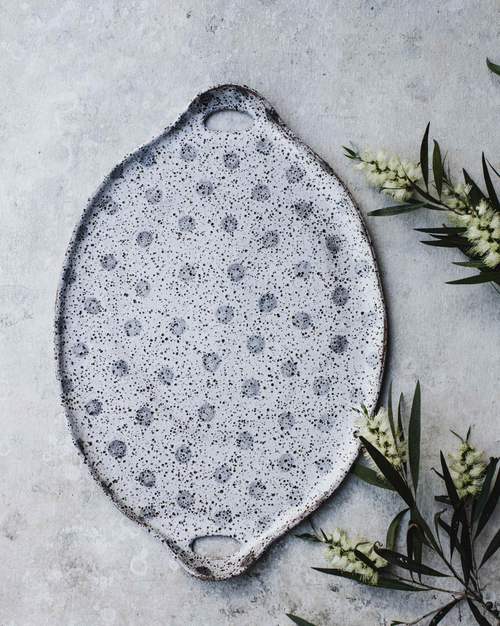 Large handled rustic polka dot platter with speckles by clay beehive ceramics