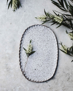 Rustic speckled white oval shaped platter with textured edging  (34.5cm long)
