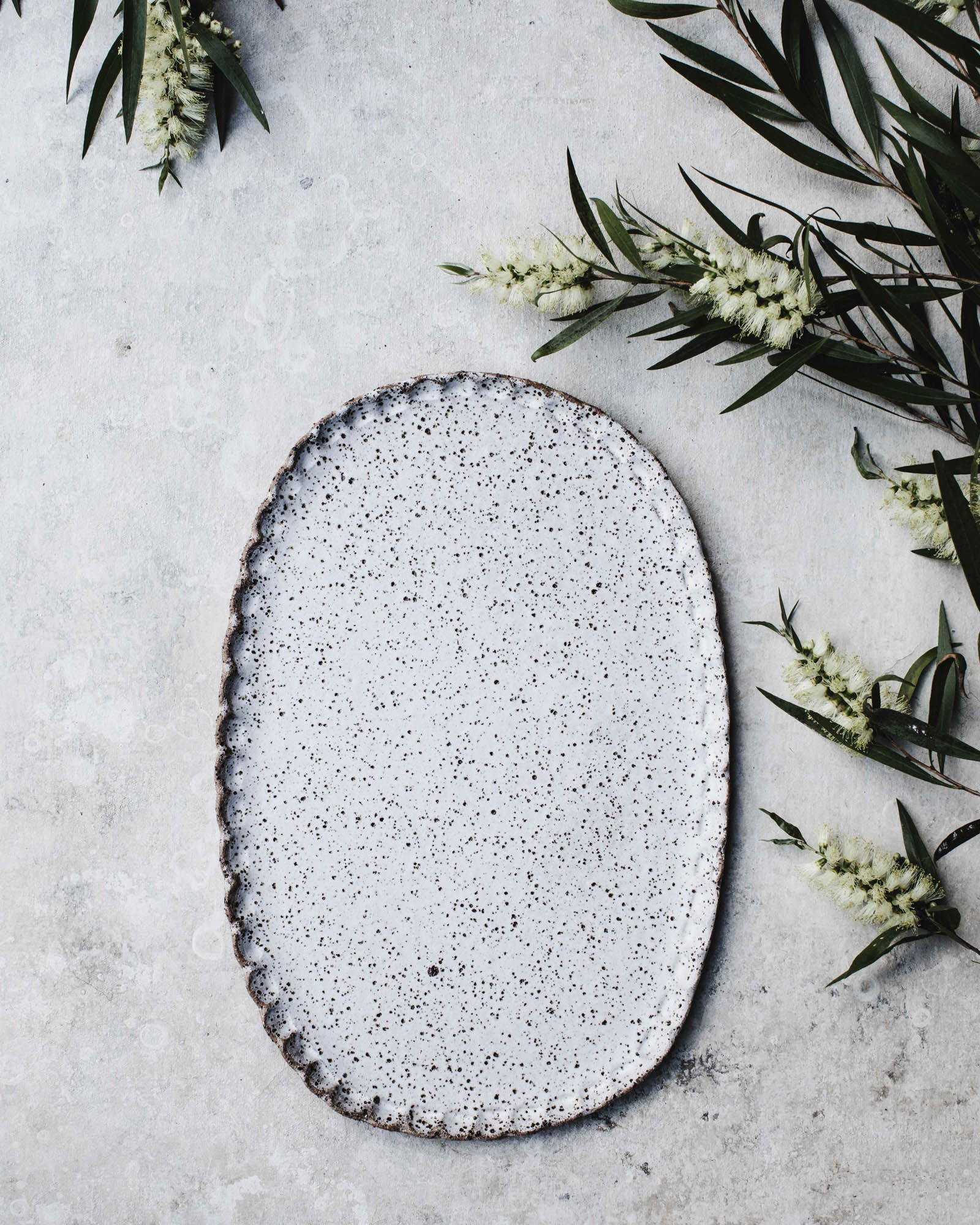 Rustic speckled white oval shaped platter with textured edging  (34.5cm long)