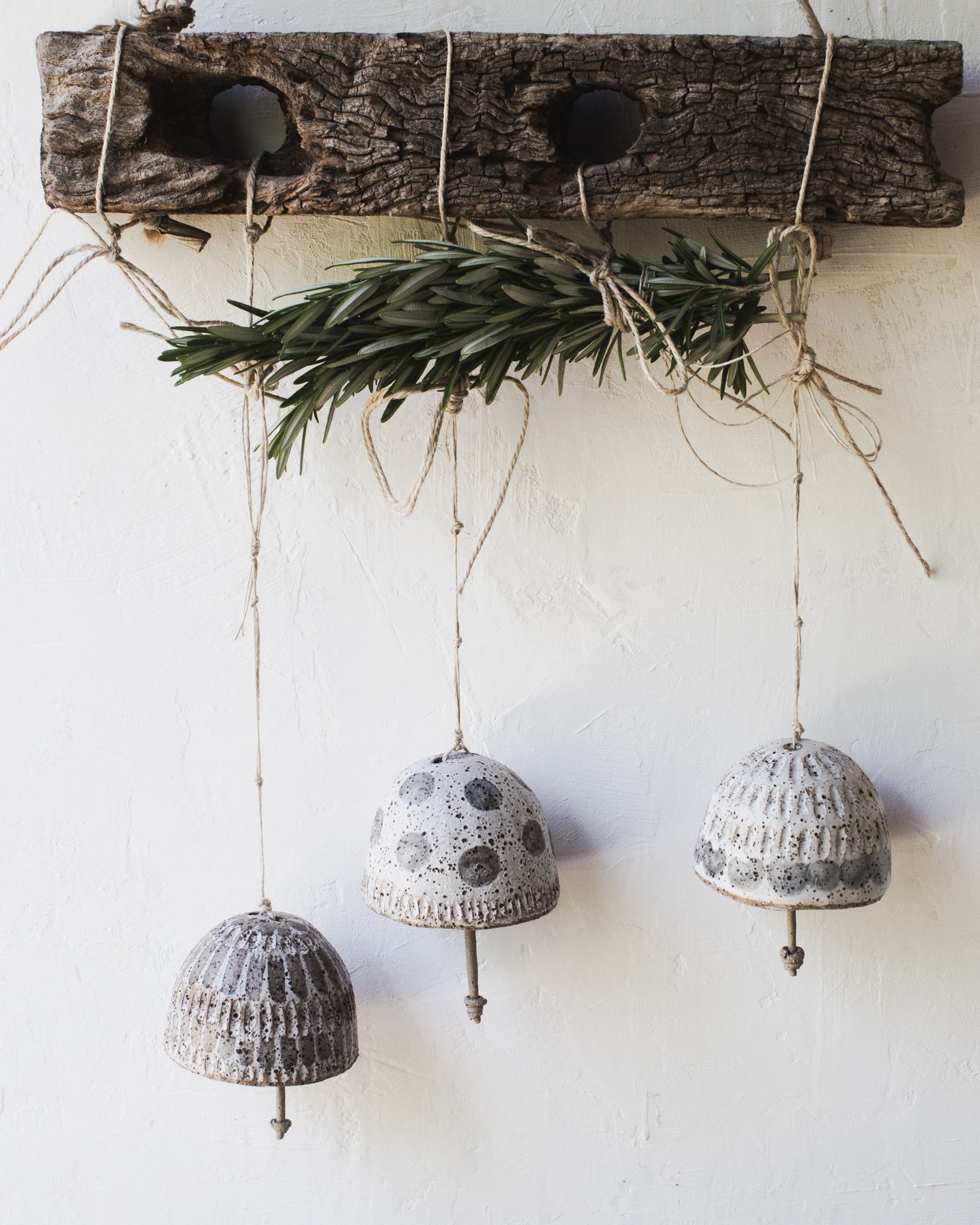Rustic carved patterned bells handmade by clay beehive ceramics