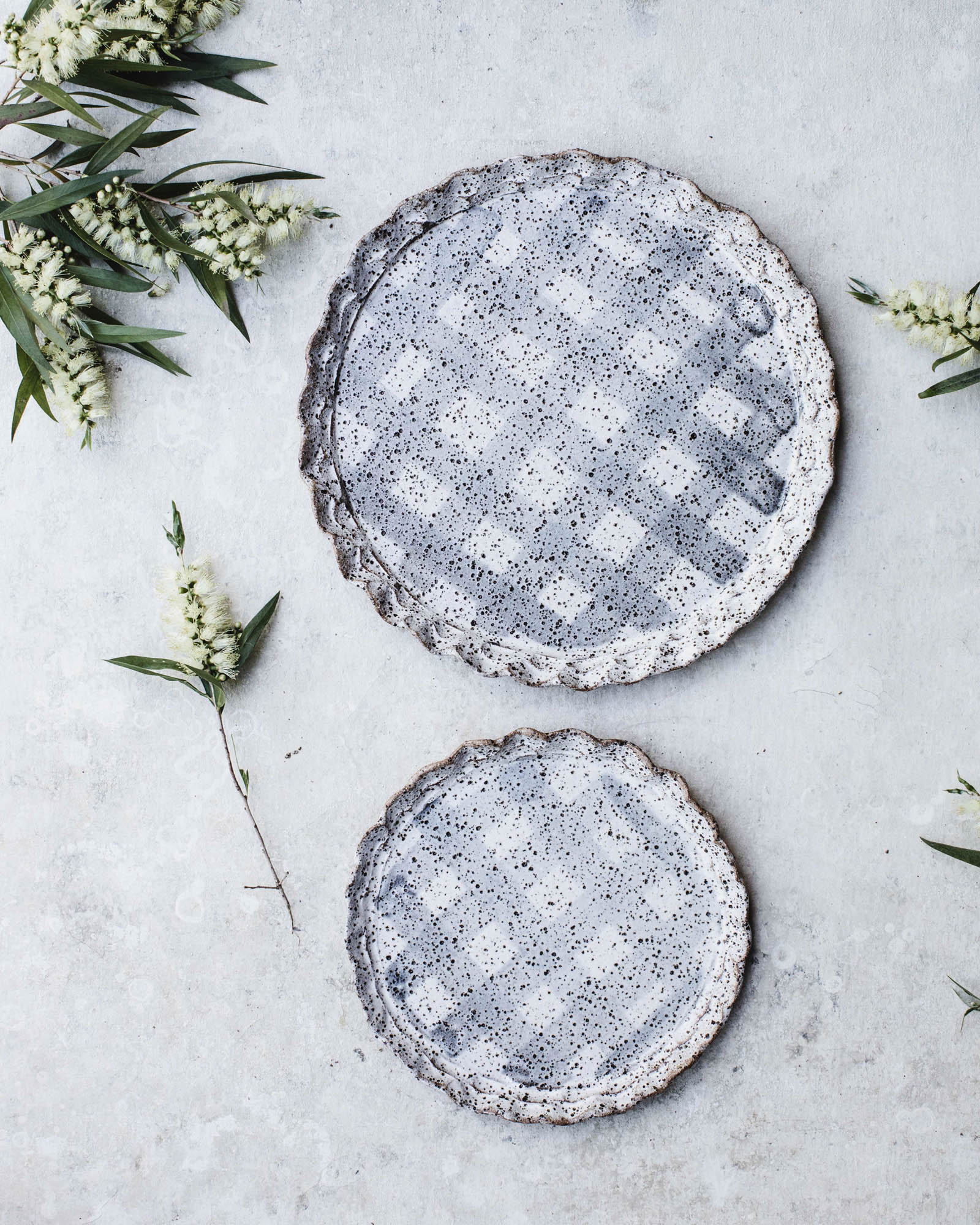 Double rimmed plates in speckled tartan pattern by clay beehive ceramics
