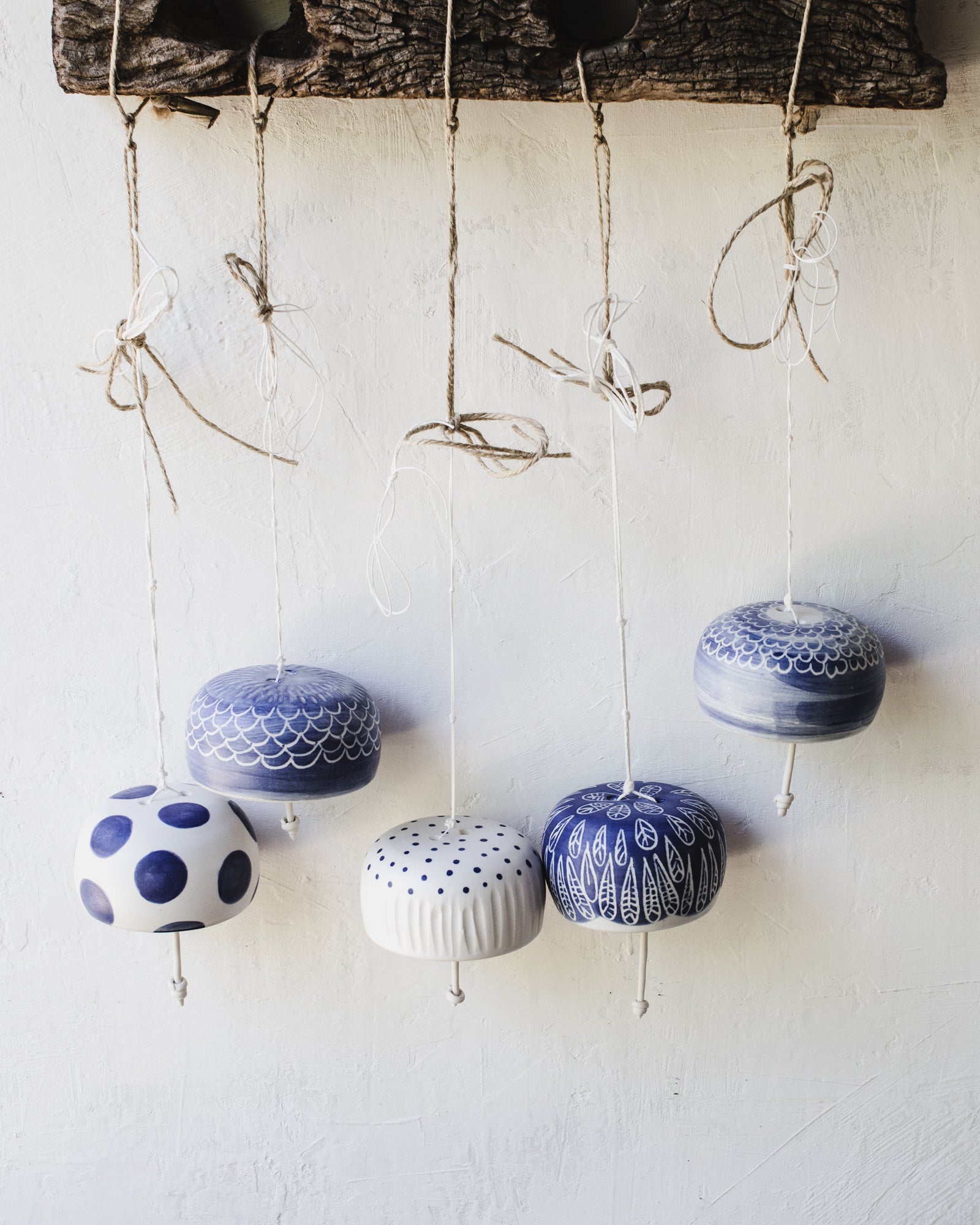 Beautiful ringing blue and white handmade ceramic bells by clay beehive