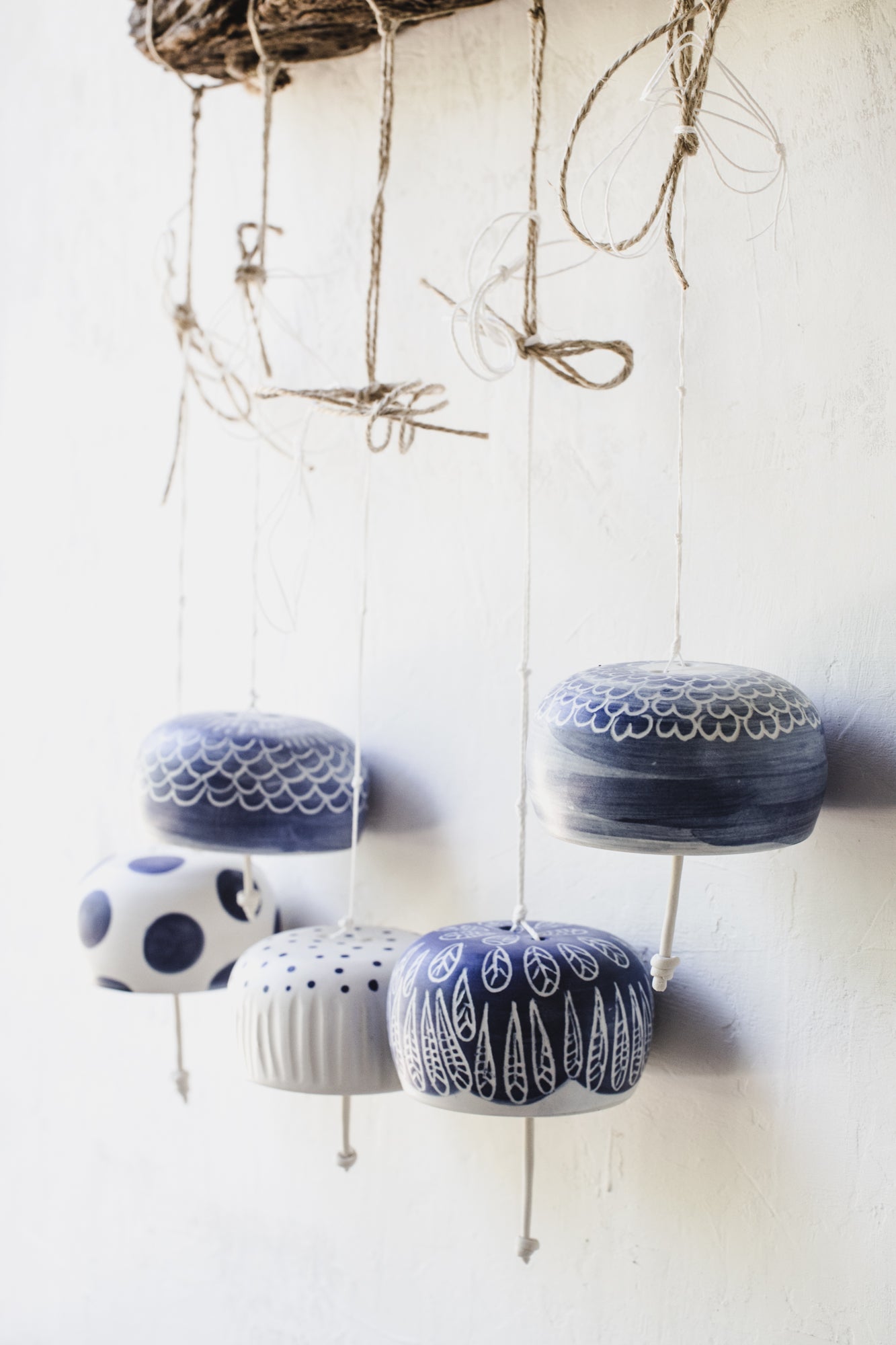 Beautiful ringing blue and white handmade ceramic bells by clay beehive