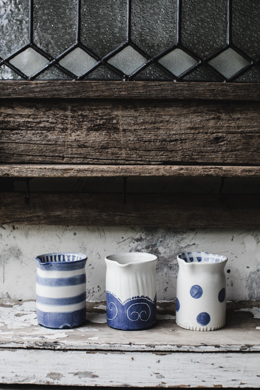 Little blue and white farmhouse jugs handmade by clay beehive ceramics