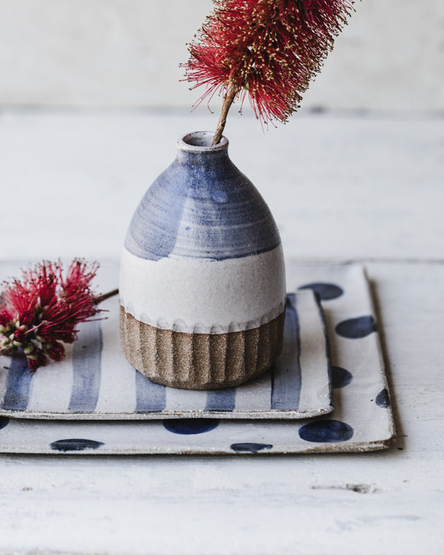 bottle vase wheel-thrown and carved in blue and white satin glaze by clay beehive ceramics