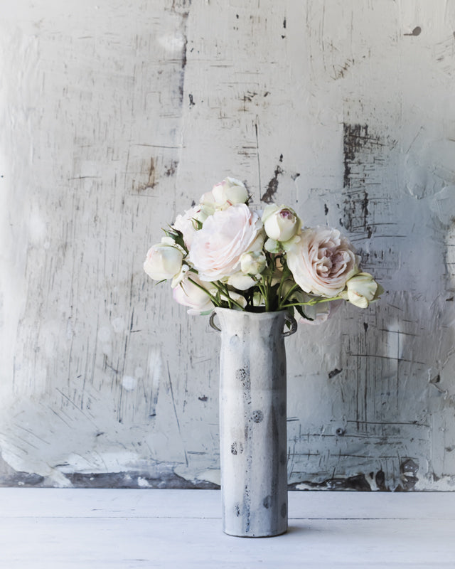 tall rustic handled handmade vase with spots and lines by clay beehive ceramics