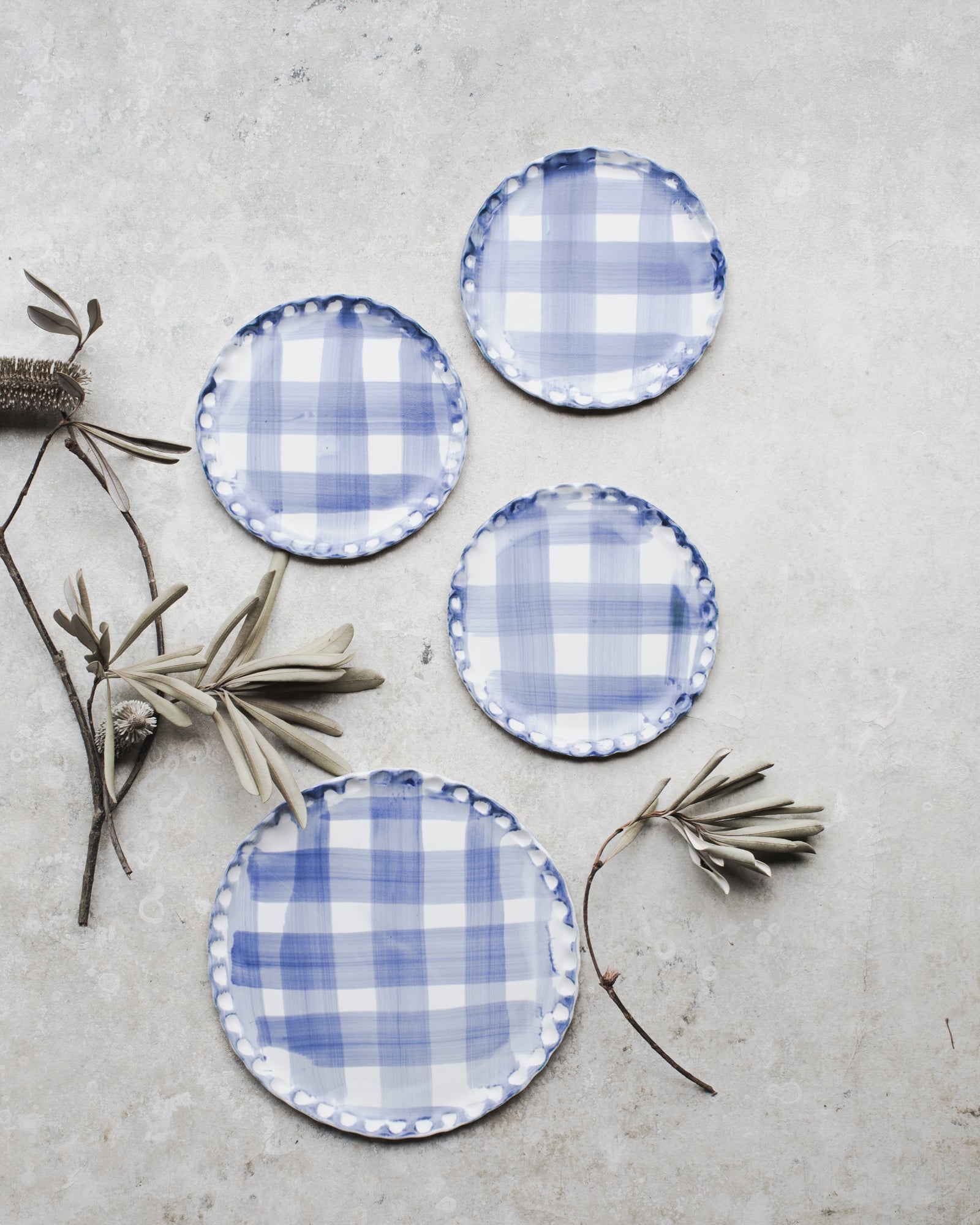 Blue and white tartan patterned scallop rim plates handmade by clay beehive
